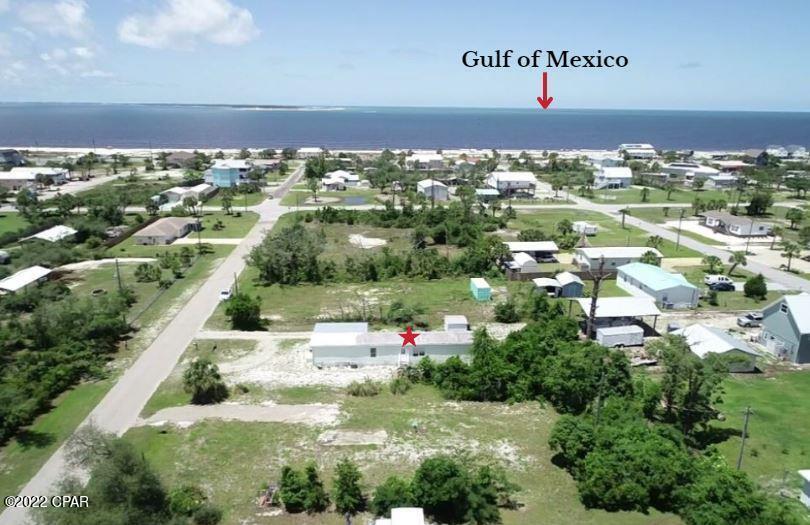 COZY 2BD/2BA MANUFACTURED HOME IN THE X FLOOD ZONE JUST A SHORT WALK TO WHITE SAND BEACHES! A spacious living area flows directly into an eat in kitchen w/new lower cabinets & LVP flooring. Continuing through to the primary suite is a relaxing garden tub, walk-in shower & oversized closet. Accommodate guests w/a 2nd bedroom & shared hall BA . Outdoor storage & a 4 seasons room gives space to stash your beach gear, kayaks & fishing poles. This large lot is just steps to pet friendly beaches & the Gulf of Mexico. Fish from the shoreline or choose from multiple area boat ramps. All you need is a golf cart to visit local restaurants for fresh seafood, live entertainment & grocers. Freshly painted w/updates throughout makes this the ideal winter home or vacation getaway! Call today!