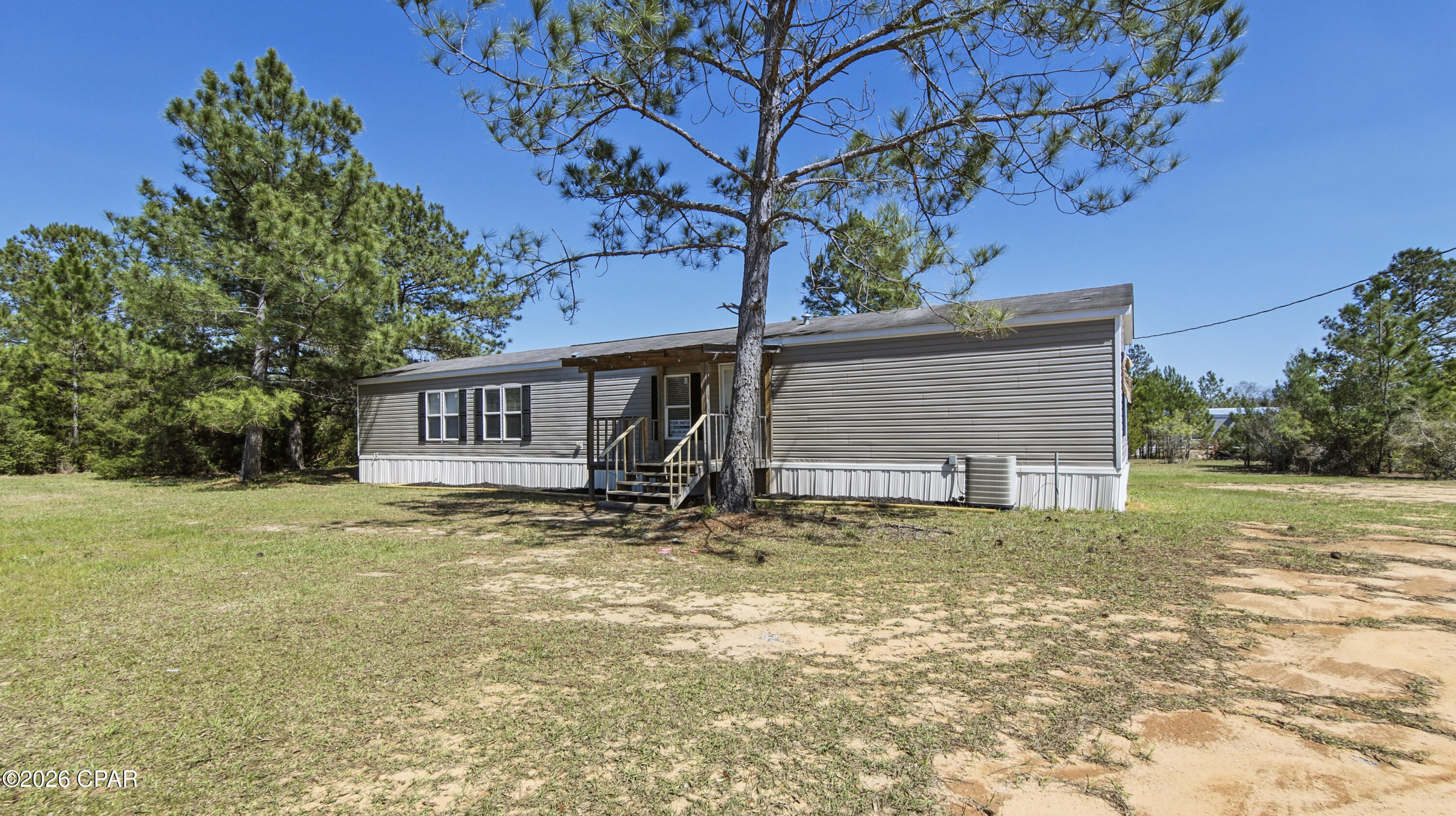 Move-in ready 3-bedroom, 2-bath home situated on a spacious 0.50-acre lot in Cottondale's Parrot Bay subdivision. This 2015 home offers 1,216 sq ft of comfortable living space with brand-new flooring throughout, new kitchen appliances, and new exterior skirting for added curb appeal and durability. The large lot provides plenty of room for outdoor living, storage, or future improvements. Perfect for first-time buyers or investors seeking an affordable property with recent updates. Utilize the outdoor storage building. Ask about available lender credits and zero-down payment assistance programs for qualified buyers, making homeownership more accessible than ever. Schedule your showing today!