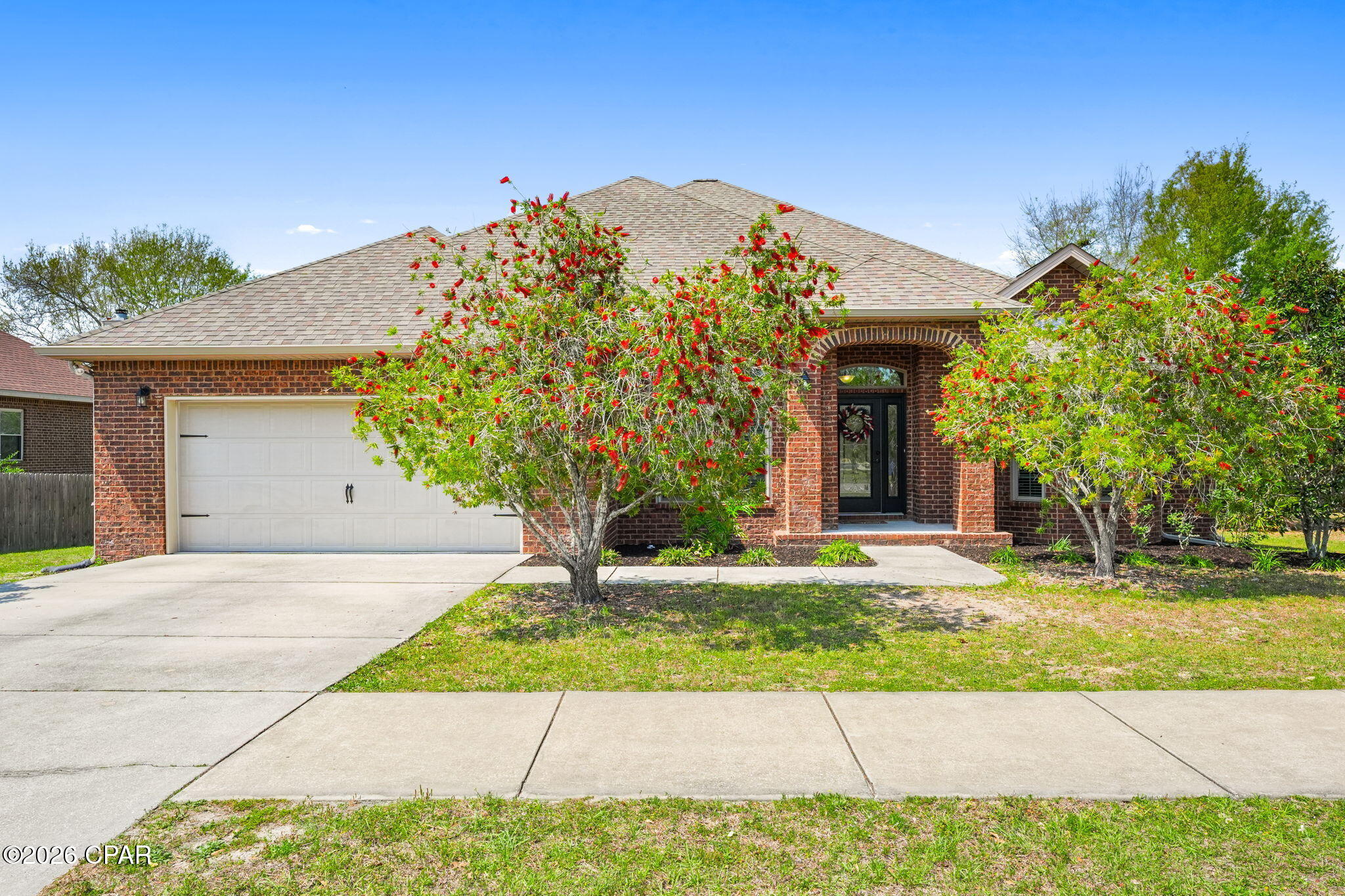 'OPEN HOUSE SUNDAY, APRIL 26TH FROM 1:30-3:30'
Welcome to this beautifully designed 4-bedroom, 3-bathroom brick home offering a perfect blend of comfort, space, and style. From the moment you step inside, you're greeted by an elegant arched entryway and tray ceilings that add character and charm throughout.
Natural light pours into this home through all of the brand new windows, creating a bright and inviting atmosphere in every room. The spacious kitchen is a true centerpiece, featuring abundant cabinetry, a large island, breakfast bar, and updated stainless steel appliances--perfect for everyday living and entertaining alike.
The primary suite is thoughtfully designed with a private en suite bathroom that includes a double vanity, soaking tub, separate shower, and a generous walk-in closet. With 3 more bedrooms this home offers plenty of space for a family, guests, or office space.
Step outside through the back doors to a spacious covered deck--ideal for hosting gatherings, enjoying morning coffee, or unwinding in the evenings. The large backyard offers plenty of room to spread out and backs up to peaceful wooded views, providing added privacy and a natural setting.
Conveniently located just 12 miles from Tyndall Air Force Base and 20 miles from the white-sand beaches of Panama City Beach, this home offers both tranquility and accessibility.
Even better--no HOA fees and an assumable VA loan opportunity add incredible value and flexibility for buyers.
This home combines timeless features with functional living spaces--ready for you to make it your own! 
Some extras to mention:
 - No city Tax
- All new Windows throughout the home
- New Luxury Vinyl Plank flooring in the main living areas.
- Upgraded appliances
- No HOA fees
- Sellers lender does not require flood insurance.