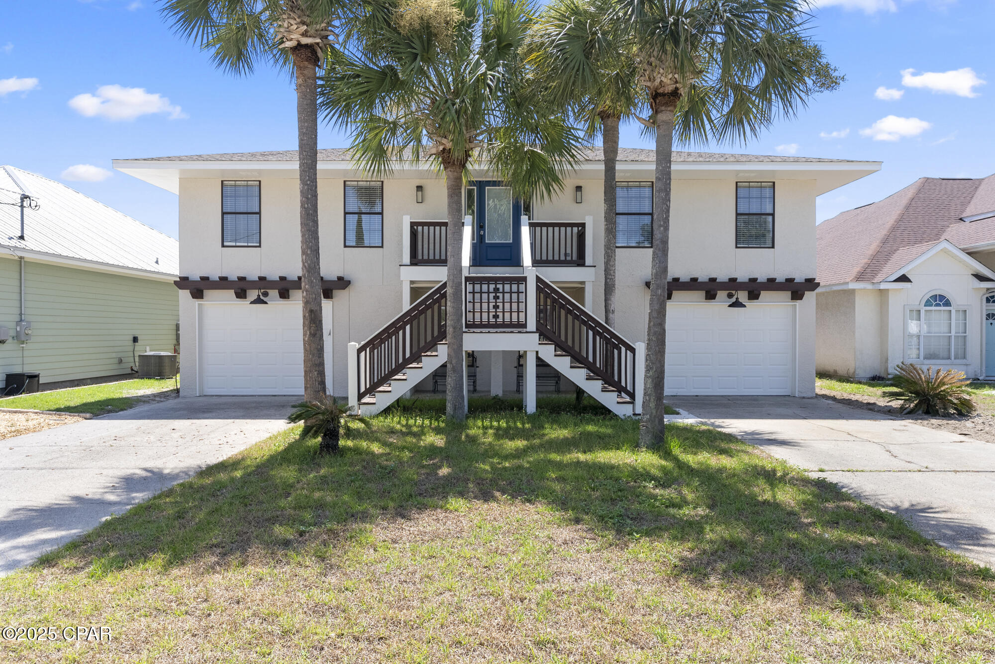 ***STUDS TO RAFTERS 5 BEDROOM, 5 BATHROOM COMPLETELY RENOVATED HOME WALKING DISTANCE TO THE BEACH*** Sellers have spared no expense in COMPLETELY restoring this beautiful family beach house approximately 2 city blocks from our beautiful beaches. The upgrade list can be emailed upon request. Upgrades include but are NOT limited to: All new drywall, vinyl plank flooring and tile throughout the entire home, wood tread staircase, interior and exterior grand staircases, impact front door, impact garage doors, new custom shaker cabinets with soft close drawers and doors, stainless steel top of the line appliances, Moen faucets, ceiling and exhaust fans, quartz countertops throughout the home, large walk in pantry room with quartz tops and new cabinets. All 5 bathrooms and kitchen cabinets and vanities have brand new brushed nickel fixtures. The upstairs entertainment area has a built in box for a 65'' television and has a built in 60'' electric fireplace, 4 floating shelves, a beverage refrigerator, wine refrigerator, and sink with disposal. Some windows were replaced, both interior and exteriors are completely repainted, all new sod and till, and there is a newly poured concrete walk/path leading to the exterior shed that if finished out would make for a great office or in-laws quarters. There are 2 separate and attached garage spaces that could be used for additional storage if need be. By now you have stopped reading...so please contact me for a full itemized and detailed upgrade list :-} All information is approximate and should be verified by buyers if important