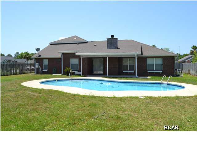 Very large 4 bedroom, 3 bath all brick home in popular Mowat Highlands subdivision. This home has it all, open and inviting living area with formal dining room, large kitchen with stainless appliances, breakfast nook, a split (private) bedroom plan and a gunite in-ground saltwater pool. The living and dining areas have durable wood laminate flooring and the kitchens and baths are all tiled for easy maintenance. A generous stainless steel appliance package, wood cabinets and a breakfast bar make the kitchen very inviting to any aspiring chef. The master bedroom is split from the 3 other bedrooms and has two walk in closets and a very luxurious bathroom with double vanities, separate shower and whirlpool tub. Two more bedrooms are downstairs and share a full bath and a 4th bedroom