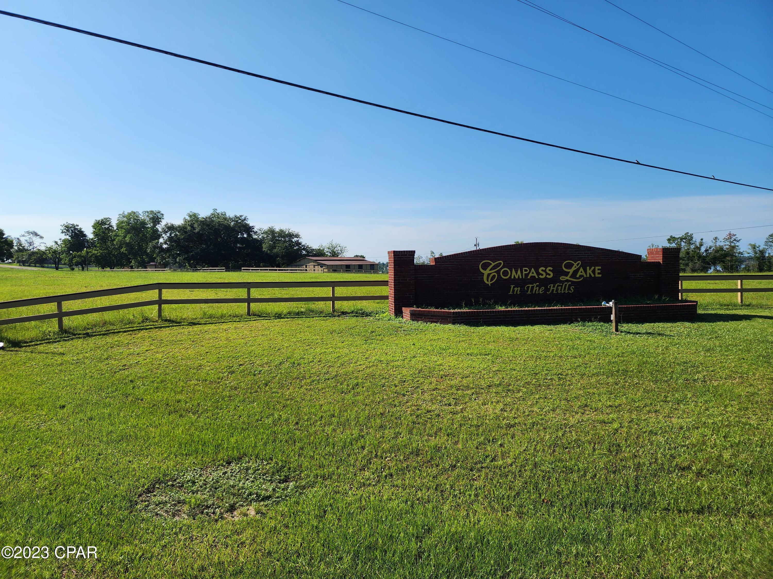 Are you looking for the ideal site for building your single-family home in a location that includes all the amenities that Compass Lake in The Hills has to offer.  This lot is quick access to 231 for all your commuter needs and right around the corner from the Community center and on a main paved road.   Compass lake is right around corner where you can water ski, jet ski and enjoy whatever kind of watersports you want.