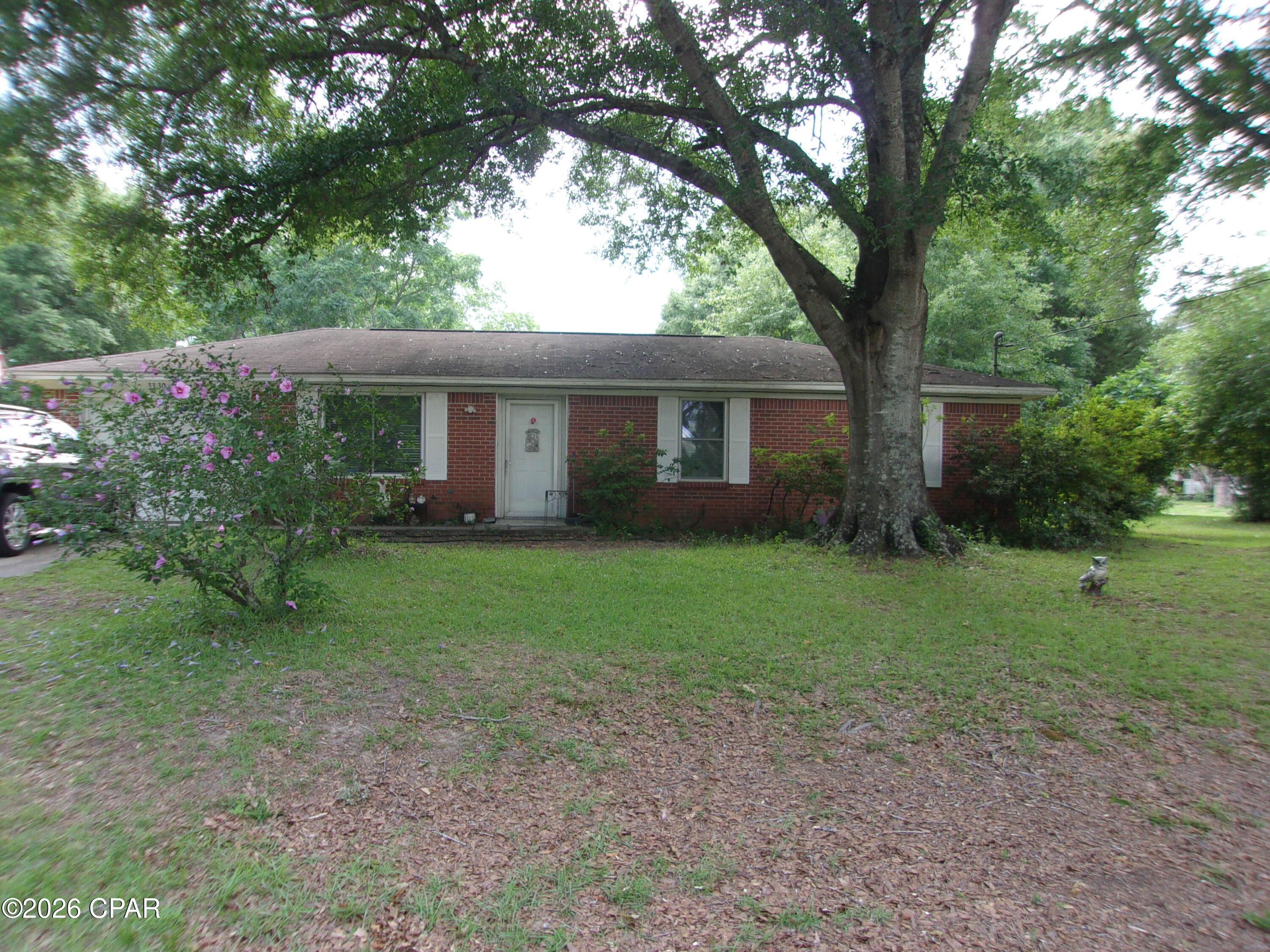 Welcome home to this charming 3-bedroom, 1.5-bath brick ranch nestled on a spacious corner lot in the peaceful small town of Esto, Florida. This inviting home features a generously sized living room that flows seamlessly into the dining area and cozy country kitchen, creating a warm and comfortable space for family gatherings and everyday living. The kitchen comes complete with a stove, refrigerator, and clothes washer for added convenience.
The half bath includes a large closet area with potential to easily add a shower or tub, offering an excellent opportunity to create a full second bath. Outside, you'll appreciate the attached one-car garage, handy outbuilding for extra storage, and the quiet surroundings that make country living so enjoyable. Conveniently located just a short drive to shopping, churches, and only about an hour from the sugar-white sands of Panama City Beach -- known as ''The World's Most Beautiful Beaches.'' Whether you're looking for a starter home, retirement spot, or investment opportunity, this property is full of potential and ready for its new owner. Come take a look today!