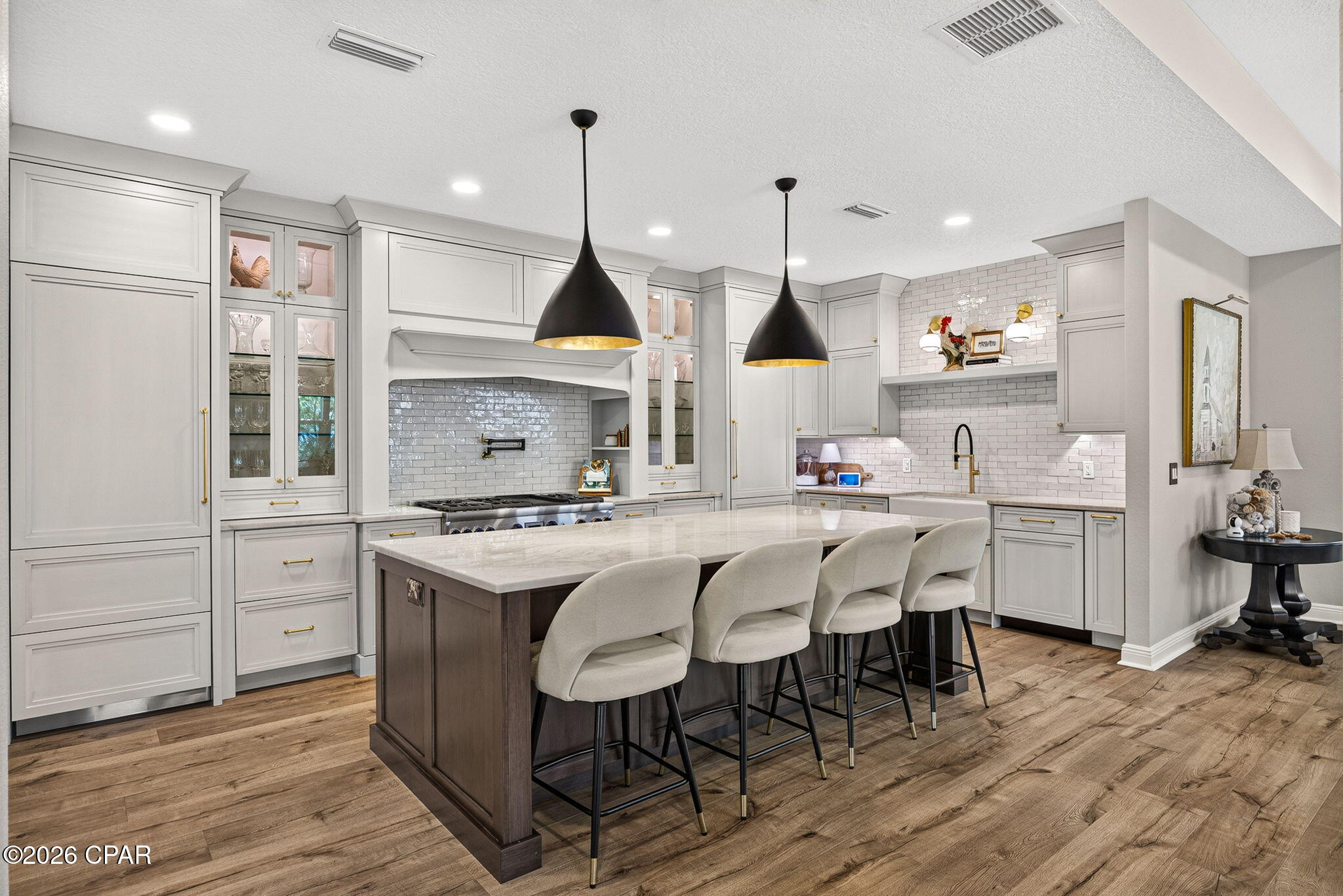 Welcome to one of the most unique and highly customized homes in Latitude Margaritaville Watersound! Located in the sought-after Phase 6BC, this exceptional Nevis Villa has been thoughtfully redesigned and upgraded to create a truly one-of-a-kind residence.

At the heart of the home is a spectacular $100,000+ gourmet kitchen that will impress even the most discerning chef. Featuring state-of-the-art Thermador appliances, a built-in Thermador refrigerator and separate freezer, 6-burner dual oven gas range, custom vent hood, pot filler, built-in coffee machine, warming drawer, wine/beverage refrigerator, porcelain sink, stunning hand-poured Moroccan tile backsplash, and gorgeous Tau quartzite countertops. Custom designer cabinetry with offers incredible functionality with features including a spice drawer, mixer lift, specialized storage solutions, and abundant workspace. This extraordinary kitchen must be seen in person to be fully appreciated.

The open-concept floorplan is ideal for both everyday living and entertaining, offering a spacious Great Room with a cozy gas fireplace, an inviting dining area, and a versatile den featuring French doors and a custom-built dry bar with cabinetry and butcher block countertop.

The private owner's suite offers a luxurious retreat with a beautifully upgraded ensuite bath featuring a frameless glass shower enclosure. The guest bedroom is conveniently located adjacent to a fully upgraded bath, providing comfort and privacy for visitors.

Step outside to enjoy the covered porch and screened lanai overlooking a peaceful preserve setting, lots of space between neighbors, creating the perfect place to relax and enjoy Florida's beautiful weather.

Additional upgrades include:
8-foot interior doors, Designer lighting and ceiling fans, Custom interior paint, Whole-house water filtration system, Attic stairs for additional storage access, Coated garage floor, Spacious laundry room with abundant cabinetry, Washer and dryer included
All TVs remain, Sonos speaker system remains. *Furniture available for purchase separately.

Enjoy added peace of mind with a Builder Master Care Warranty through October 2026 and a 10 structural warranty from the original build date.

The Villa HOA provides outstanding low-maintenance living, including lawn care/ landscaping maintenance, exterior painting, and roof replacement on a scheduled maintenance program.

Latitude Margaritaville Watersound offers a resort-inspired lifestyle unlike any other on Florida's Emerald Coast. Residents enjoy a world-class amenities campus featuring a 2 story full service restaurant, resort-style pool, fitness center, pickleball and tennis courts, walking and biking trails, live entertainment, social clubs, events, and endless opportunities to stay active and connected. Located along the Intracoastal Waterway and just 7 miles from the white-sand beaches of Panama City Beach, residents also enjoy convenient access to Pier Park, Northwest Florida Beaches International Airport, dining, shopping, boating, and the exciting new commercial district anchored by a future Publix grocery store, as well as a new hospital currently under construction just minutes away. This is more than a home--it's a lifestyle.