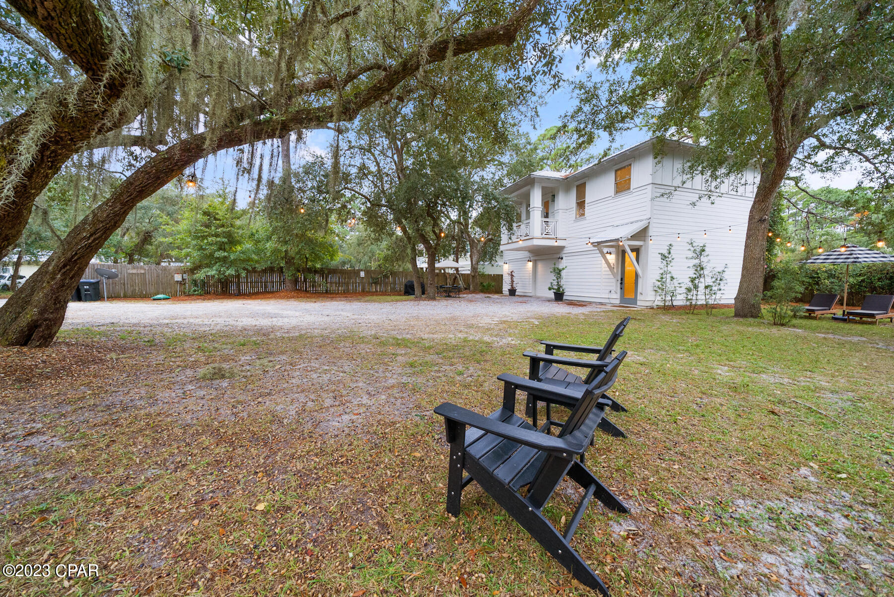Nestled beneath majestic oaks in historic Grayton Beach, this property reflects the beauty of old NW Florida.  The oversized lot boasts a furnished 2/1 residence,  plus 3 car garage.   Currently income producing  Directly across the street to the east, sits Western lake.  Offering tranquility and privacy within the fenced perimeter, the parcel sits only 1/4 mile north of the emerald waters of the Gulf of Mexico.  Fine dining, shopping, fishing, kayaking, boating, biking and beaching are some of the pleasures available at Grayton Beach.  The slow paced surrounding atmosphere is celebrated by residents and visitors alike in this quaint coastal community. NO HOA!  The existing 3 car garage can easily be transformed into a significant extra H&C space, to include a large living area, two bathrooms and 2 bedrooms.  Quote is available upon request.  SO MUCH MORE EXCITING POTENTIAL!! Buyer/Buyer's Agent to verify all information deemed important