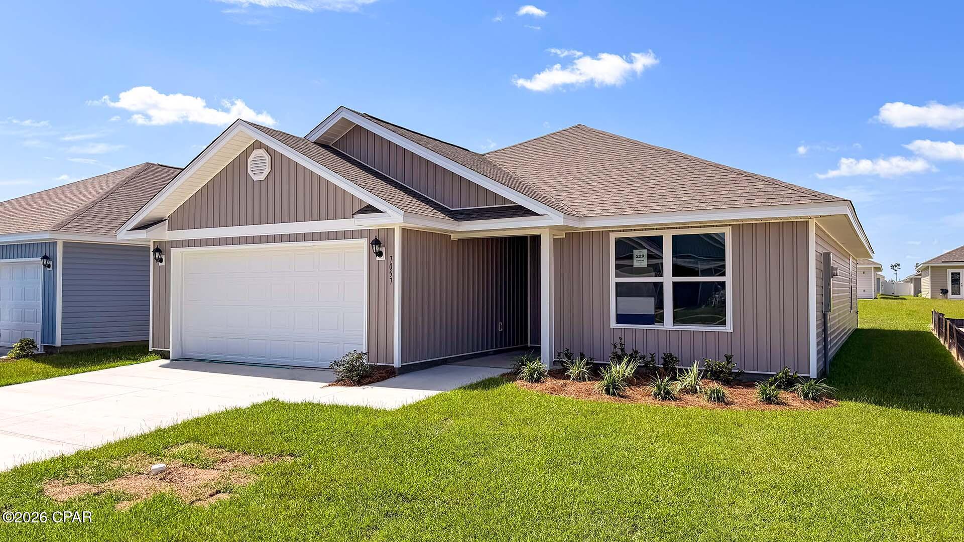Welcome to the Lismore, a new home floor plan located at Liberty in Panama City, Florida. The Lismore is thoughtfully designed 3-bedroom, 2 bathroom, one-story home with 1.580 square feet of modern living. On the outside of your home, you will see durable vinyl siding, a spacious two-car garage with an opener and a fully sodded yard to the property lines. This home comes equipped with dimensional shingles with a limited lifetime warranty, electronic deadbolts on all exterior doors, weatherproof outlets, and hose bibs. Sidewalks line the neighborhood streets for you to enjoy the beautiful Florida weather at Liberty. Inside you will see 8' ceilings throughout, engineered vinyl plank flooring throughout the home and carpet in the bedrooms. The front bedrooms, bathroom, and garage are close to the front door and welcome you into an open living room and kitchen, perfect for having guests over. Granite countertops, white cabinetry with soft-close are in the kitchen and bathrooms, and the kitchen island make hosting or serving dinner at the bar a breeze. Complete with a pantry, and stainless-steel appliances including smooth top range, microwave, and dishwasher means your kitchen is fully equipped. The living room has plenty of windows for natural lighting and leads right to the back door. Each bedroom comes with soft carpet floors and spacious closets. The Primary Bedroom features a bathroom with a detached shower and double vanity with granite countertops. The walk-in closet is adjacent to the bathroom, meaning more space in your bedroom. As with all the homes in Liberty, your home is outfitted with the latest Smart Home technology allowing you to manage your home right from your phone, making your comfort easy and exceptional. Our Liberty community features underground utilities making it less susceptible to damage from severe weather leading to fewer outages and more reliable service. Residents of Liberty can enjoy exclusive access to two amenity centers, complete with two pools, a children's splash pad, two playgrounds for endless fun, a well-equipped gym, poker room, yoga room, two pickle ball courts, basketball court, and a well-equipped fitness center. Embrace the lifestyle you deserve where every detail is curated for your ultimate enjoyment.