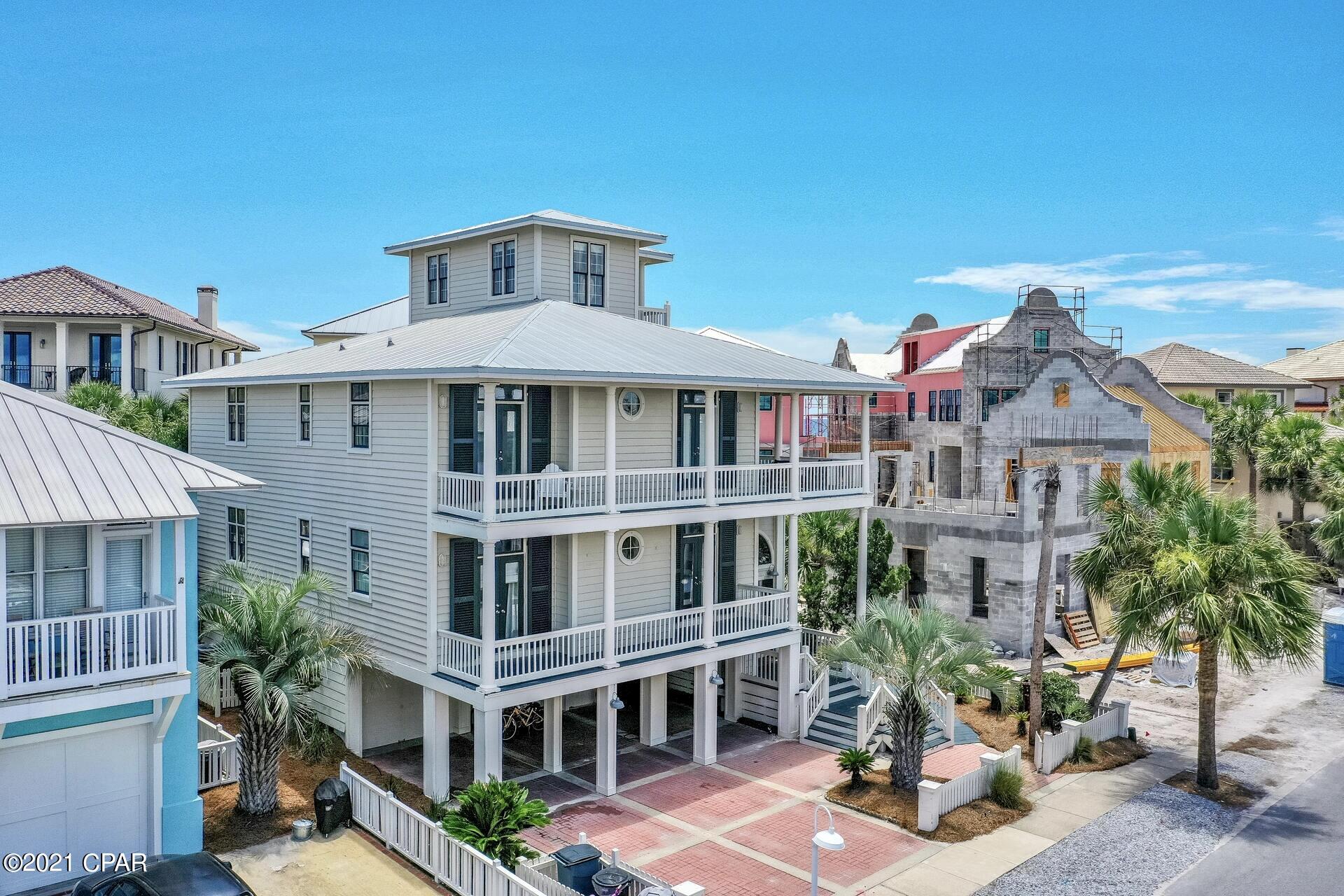 CURRENTLY UNDER CONTRACT, SELLER ACCEPTING BACKUP OFFERS This well-situated home, with multiple entertaining spaces, is perfect for creating lasting memories.  ''Family Matters,'' just one lot from the beach, with  an oversized tower, affords multiple  (2nd & 3rd floor) stunning views of the Gulf and Lake Carillon. Steps to the main community pool, this beach home offers 6 bedrooms, 4 baths, 2 laundry closets, great room, gourmet kitchen, wrap around porches,  separate media/entertainment area w/ large screen tv/surround sound,  wine cooler, ice-maker, refrigerator, microwave/stainless appliances. The lower level features a double garage with two large storage areas plus two additional coved parking spaces. Very strong rental income potential and easy show.