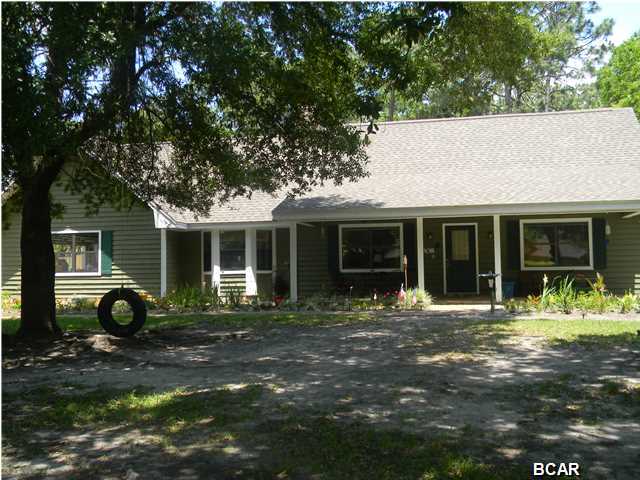 If space is important and not having a neighbor under you when you walk out the door, THIS is the home for you. Home sits on a large lot 135 feet wide and 195 feet depth with a large 17 x 60 gunite lap pool in the back, still plenty of room for whatever you would like, a garden, volley ball area, this property has the space. After your laps in the pool, sit on the front porch and enjoy the beautiful shade trees. Love this LOT.... Inside the home, nice open floor plan featuring vaulted and beamed ceiling, stone fireplace, hardwood floors, separate breakfast nook and more. Home is conveniently located to shopping and restaurants.