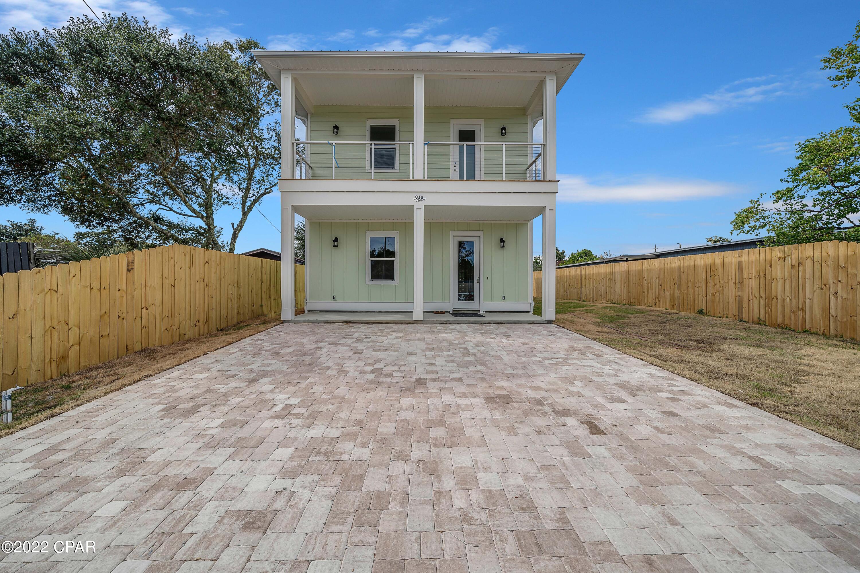 LIVE YOUR BEST BEACH LIFE! BEAUTIFUL BRAND NEW CONSTRUCTION - Location Location Location! This beautiful, luxury, custom home is located just a short walk to the Spectacular Sugar White Sands of the Gulf of Mexico.  Home is zoned for SHORT TERM RENTALS!! The builder incorporated a versatile floor plan that would accommodate 2 families on vacation and to many upgrades to list. The fantastic Beach Home has a Master suites upstairs with full bath, Sitting area, a two additional bedrooms with Jack N Jill Bath. All upstairs bedrooms open out to  and a spacious balcony. Downstairs has a large bonus room with full bath that could be used as 4th bedroom. A conveniently located 1/2 bath off of the kitchen. Spacious Pantry with washer and dryer off of the Kitchen. Additional upgrades include High Ceilings that really open up the floor plan, LVP flooring, Upgraded Cabinetry and fixtures, 8' interior doors, SS Appliances, Hardy Siding, Paver driveway. Completely fenced yard with room for extra parking or room to park a RV or Golf Cart. The dedicated beach access is just at the end of Wisteria Lane. All information is deemed accurate but should be verified by the buyer if important.