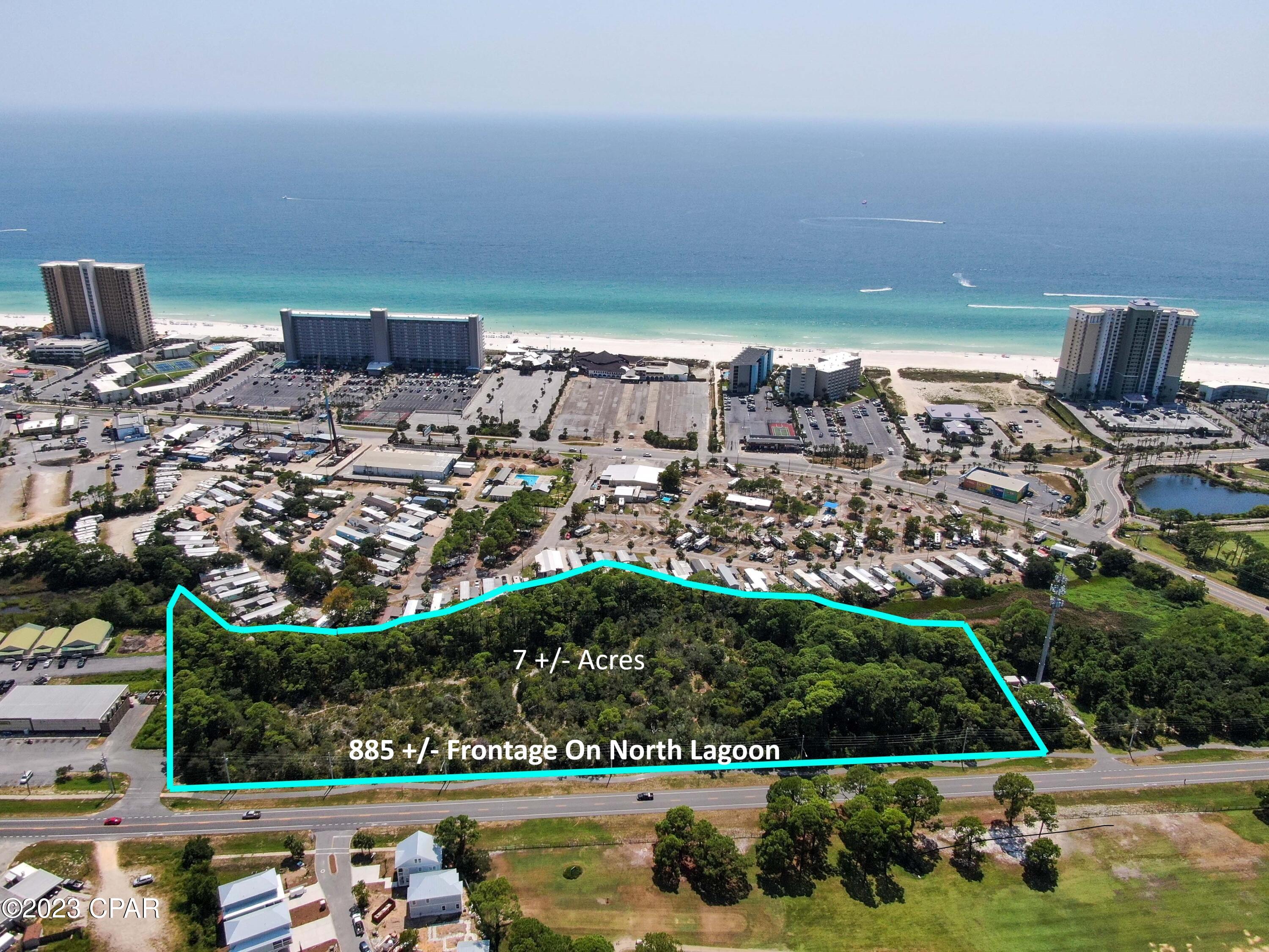 7 Acres in the Heart of Panama City Beach located across from Signal Hill Golf Course. Prime location for a hotel, multifamily development or resort. Almost 900 feet along North Lagoon, you are less than 1500 feet to the beach. This property is located in the Tourist District and is zoned Commercial High Intensity. The property can be developed for up to 200 hotel rooms or 74 townhome units.  Conceptual Renderings are available. Topographical and Boundary Survey on file.