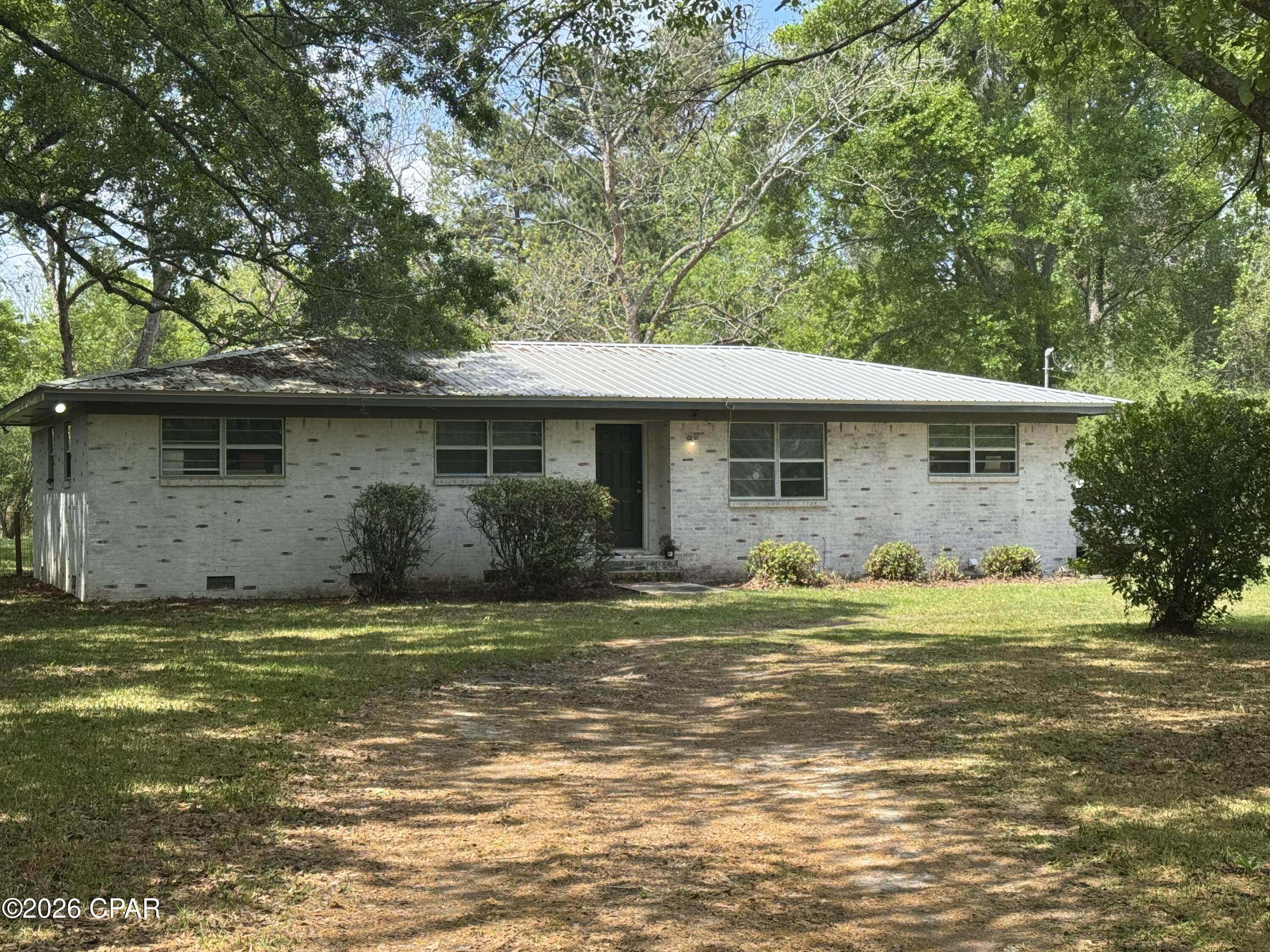 Looking for a cute brick home on a paved road close to town this could be the one. Large fenced back yard ,with a screened porch to rest and watch the sunset.  This home offers 3 bedrooms and a full bath. This home has had several up grades in the past 6 years, new kitchen cabinet's, a/c , roof , painted inside and out. H s a one car carport on the back that could easily be closed in to make a den , office or add a master bedroom with a bath. Call for your appointment to veiw today .