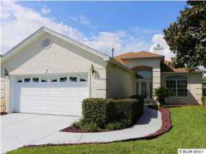 This immaculate, 3 bedroom ,2 bath home is located on the west end of the beach in the golf cart friendly Southfield community. This home is located within 1/2 mile (or 1800 feet) of the beach. Pride of ownership is evident in this lovely brick home custom built by Ron Putman Construction. The living room features a tray ceiling and gas fireplace. This home has an open floor plan with the kitchen/dining open to the living area and Florida room. The master bedroom features a walk in closet, fabulous master bath with a double vanity, garden tub and a glassed-in separate spacious shower. The master bath also opens to the marvelous Florida room. There are two additional bedrooms and another full bath; plenty of room for family and friends. This home has many upgrades such as; Pella