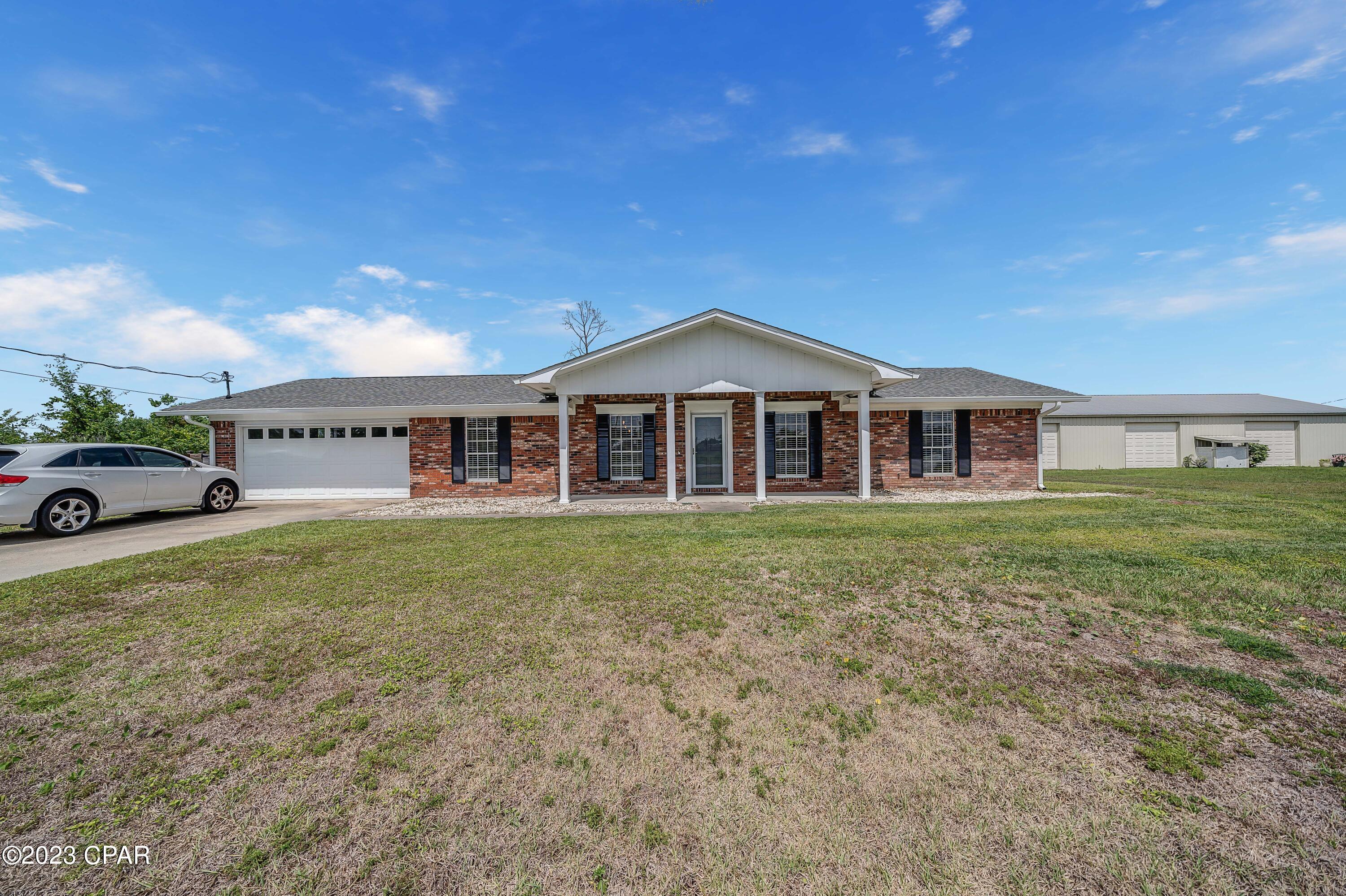 UNDER CONTRACT - SELLER TAKING BACK UP OFFERS!!!  Welcome home! This beautiful, cozy, 3 bedroom, 2 bathroom, updated, Ranch style, all brick, cul-de-sac home with a 2 car garage on ~1/3 acre with a privacy fenced in backyard, neighbors only one side and no HOA fees has a lot to offer. A new, all glass storm door welcomes you as you enter the home into the foyer with beautiful LVP flooring throughout (no carpet!). The large front windows bring plenty of natural light into the dining room, kitchen and two guest bedrooms. To your left is the dining room with a table that seats 6, a shiplap accent wall and industrial drop lighting fixture. The breakfast bar welcomes you into the kitchen with all 2019 Samsung stainless appliances, farm sink, shaker cabinets and plenty of gorgeous butcher block counter space. The living room is cozy with a shiplap accent wall, HDMI conduit, wood accent mantle and wood burning fireplace. The large laundry room is located just off the kitchen with plenty of space for storage or additional cabinets. The fully finished two car garage provides plenty of storage room and space for two vehicles. Down the hall to the left is a rustic barn door leading to the guest bathroom with an updated console vanity, rustic wood shelving, shiplap walls and a shower/tub combo. Across the hall are two very nice sized guest bedrooms. The master bedroom ensuite is located at the end of the hall to the left. Plenty of room for your king size bed and furniture. The master bathroom has  one area for the updated console vanity, shiplap walls and rustic wood shelving and a barn door separating it from the shower/tub combo area for additional privacy. Off of the kitchen are French doors that lead to the enormous backyard with plenty of room for a workshop, outdoor kitchen, trailer storage, a playground or anything else your heart desires. The roof, appliances, lighting, LVP, kitchen updates, bathroom vanities, shiplap and barn doors were all added in 2019. Since 2019, the home boasts the following new, significant updates: new energy efficient duct work including HVAC returns in each of the rooms, seamless gutters, Wi-Fi controlled water heater and thermostat, a 16 Seer HVAC unit, whole home air purifier and front storm door. The dirt road has now been paved adding significant value to this home as well. Located in the heart of Panama City, FL, this home is a must see.  Verify measurements if important.