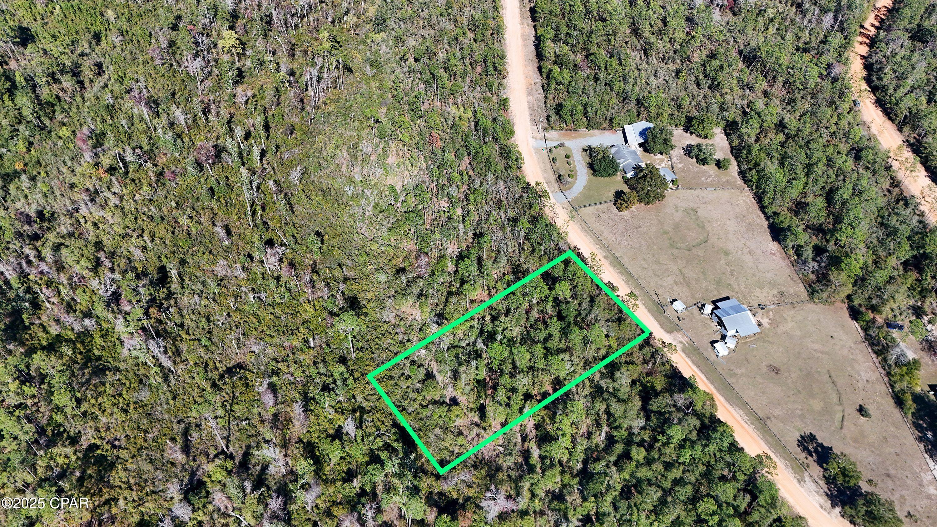 You'll love this peaceful 1+ acre lot located in Compass Lake in the Hills. Perfect for building your new single-family home or placing a manufactured home, this beautiful property sits within a 10,000-acre community positioned ideally between Dothan, AL and Panama City Beach, FL. The neighborhood features two gorgeous lakes and a wide range of amenities. HOA membership is voluntary for $135 annually and includes access to lakeside beaches, swimming pool, canoe/kayak/fishing boat rentals, boat launch, pavilion/clubhouse rentals, fishing, boating (electric motors allowed), golf driving range, and disc golf. The community also offers an onsite restaurant, Olle's, known throughout the area for its fantastic German cuisine. All measurements are approximate; buyer to verify via survey.