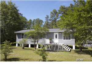 JUST REDUCED... Seller said ''get it sold''.... Cute Starter or Rental Home. Perfect for the snowbirds too! This cute Cottage is located just a block from paved road on a county maintained dirt road. Private, yet not to far to town or the beach. This home has had almost all the remodel completed for you, a few projects need to be done, by the new owner. This home has new windows, new 25 year roof, new sinks, new kitchen cabinets, new tile back splash, upgraded keyless front door, new ceilings, new plumbing. YOU MUST COME AND SEE THIS HOME. This home features new laminate hardwood floors, open living space, new light fixtures and new ceiling fans . The main bath has a large walk-in new tiled shower with a beautiful new vanity and new sink. The bedrooms are spacious, large closets.Got to see