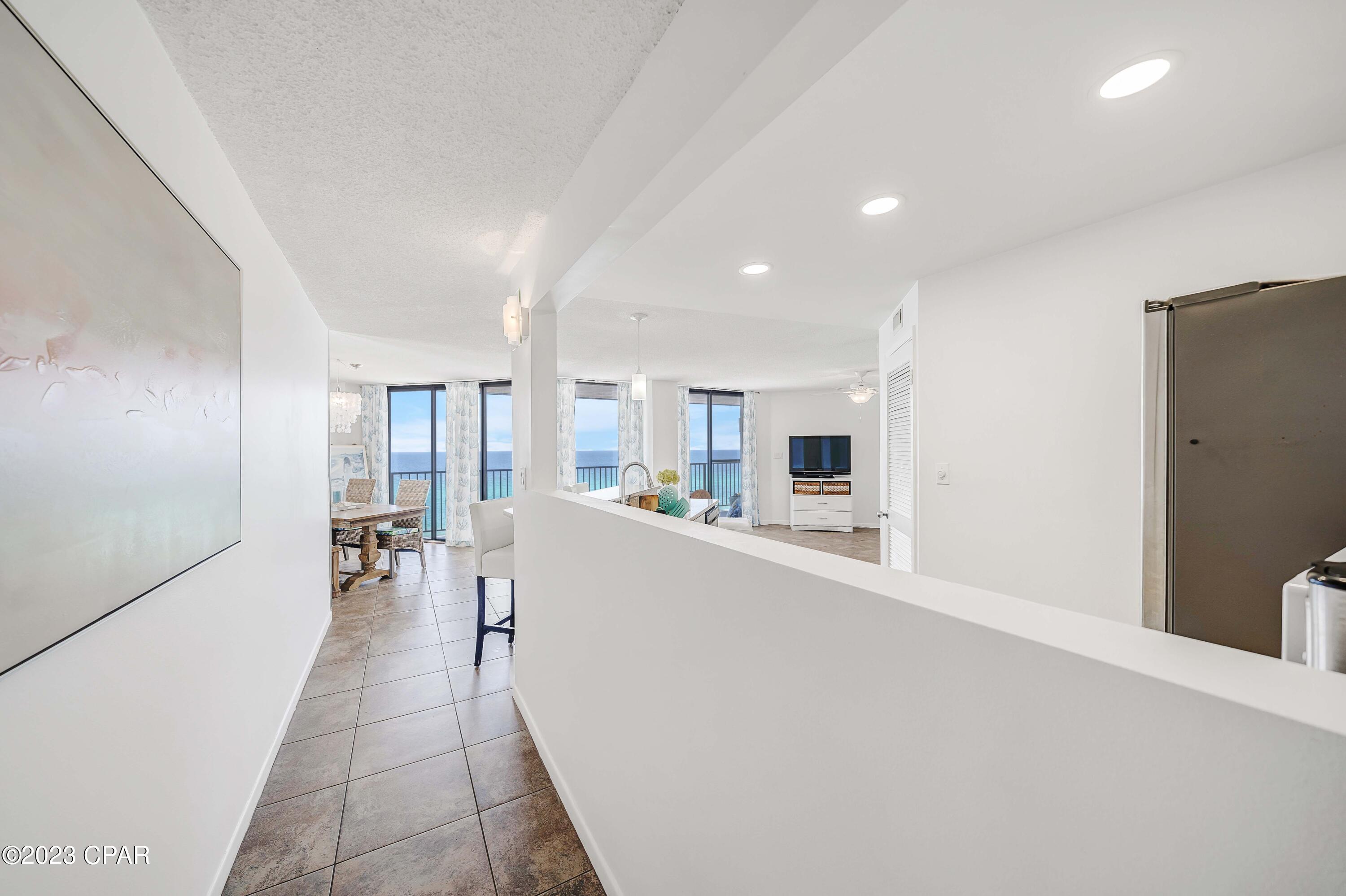 CURRENTLY UNDER CONTRACT, SELLER WILL CONSIDER BACKUP OFFERS. Come bring offer on this gorgeous top floor condominium!  Panoramic views and no one above you!  This recently remodeled condo in popular Aquavista is pure perfection, welcoming you to the beach with a bright and beautiful interior.  Open the door and notice that the inside colors blend perfectly with the sugar white sand and crystal blue waters of Panama City Beach.  Remodeled with quartz countertops, new cabinets, stunning new master bath and guest bath, impressive tile work, and more!  Relax and enjoy sipping on a beverage, reading, sunbathing, or just relaxing on your generous sized balcony.  The open floor plan allows you to take in the gulf views from anywhere in the kitchen, living or dining room.  Aquavista has one of the best deeded beach areas along all of the Emerald Coast.  This low density complex has 2 towers and is only 8 stories high so you have a huge stretch of beach to sink your toes in the sand. Convenient parking underneath your building and 4 elevators, so no long elevator lines! Fully furnished and turnkey for you - this is the place you want to call home!  Also perfect to make it your 2nd home at the beach, and rental ready for you to step into summer.  Call us today!