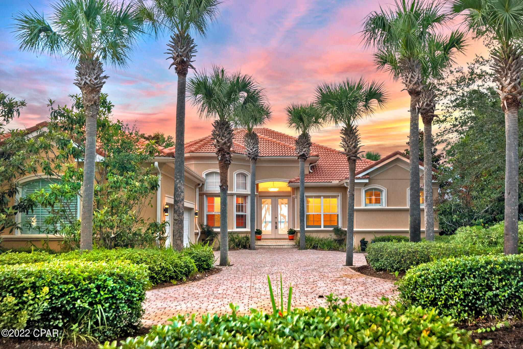 Discover what bay-front living exemplifies with 97 feet of water frontage! One owner, custom quality built bayfront home on the coveted, peaceful street of Emerald Bay Drive. This sophisticated, yet relaxing haven makes the most of its tranquil, waterfront setting, allowing the beauty of surrounding bay views to create a feeling of relaxation throughout. A striking semicircular driveway surrounded by lush landscaping provides for ample parking for guests and access to the oversized three car garage. Upon entering the home, the infinity pool and expansive breathtaking bay views are impressive. The spacious great room is perfect for indoor/outdoor entertaining. As it opens to a covered porch, cabana and outdoor BBQ area with gas grill and smoker. This quality built home is made from concrete block construction. The garage also has an 240 electric outlet to install an electric vehicle charger. The cabana offers a full kitchen and bathroom to provide for easy poolside access. The finely appointed kitchen yields ample custom cabinetry with granite countertops, gas cooktop, pantry and beautiful bay views. This home features two primary bedroom suites, each with its own en suite bath. Privately positioned in the split floorplan, the spacious master suite also boasts a fireplace and stunning bayfront backdrop. Notable features include home office, cabana, surround sound and security system. This single story forever home has been meticulously cared for by one owner. The home and cabana are concrete block, quality construction. The gated community of Emerald Bay offers low HOA fees and has a premier 18-hole golf course. This property has proximity to world class shopping, dining and local entertainment as well as golf courses, Whole Foods and Legendary Yacht Club.

1422 Emerald Bay Drive offers a peaceful sanctuary for enjoying serene sunset vistas, golf, fishing and watersport lifestyle.