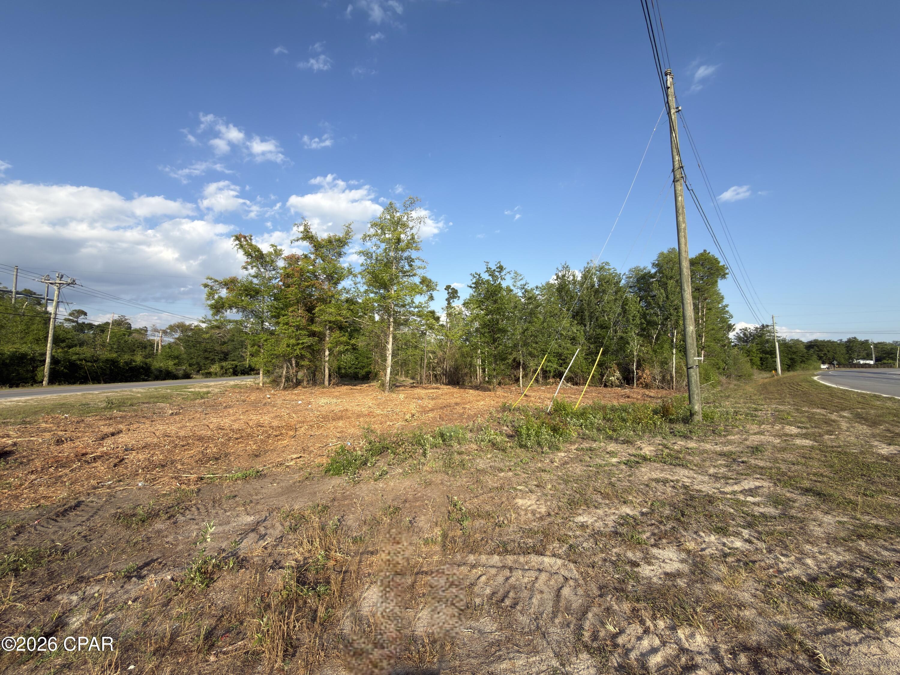 This 1.67-acre corner lot is positioned at the corner of Camp Flowers Road and Hwy 2301 in Youngstown, FL. This rural residential parcel offers strong visibility, convenient access, and plenty of space for your future homesite, recreational setup, or long-term land investment. Located close to area boat ramps, minutes from Econfina Creek, and a short drive to Panama City Beach, this property gives you the quiet country setting while still keeping you within reach of the water, beaches, shopping, dining, and everyday needs.