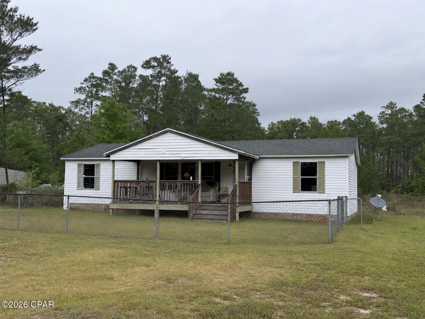 Enjoy 3 acres of spacious land in Southport Florida. The manufactured home that sits on the property is a three bedroom two bath home. Perfect for investors looking to put a little TLC into this property to make yours. For more details contact listing agent. Some photos may include virtual staging or AI enhancement.
