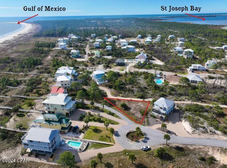MOTIVATED SELLER - BRING ALL REASONABLE OFFERS! Exceptional 1st tier homesite with Gulf views located on the highly sought-after South Cape within the gated community of South Beach. This prime lot offers the rare opportunity to build your dream coastal retreat with no required building timeline, allowing you to create your ideal beach home at your own pace. Perfectly positioned just steps from the sugar-white sands and uncrowded, pet-friendly beaches that make Cape San Blas so desirable, this property offers both privacy and lifestyle. Community amenities include deeded beach access, a dedicated dock, and underground utilities, creating a seamless coastal setting for full-time living, a vacation getaway, or an investment property. Spend your days fishing from the shoreline, biking along miles of scenic paved nature trails, or exploring nearby Salinas Park with kayaking, horseback riding, pickleball courts, and bay access. Local restaurants, fresh seafood, live music, and laid-back coastal charm are all just minutes away, making every day feel like a vacation. For buyers seeking investment potential, the area is known for strong vacation rental demand and year-round visitor appeal. A recent survey is available, allowing you to begin planning and designing right away. Discover why so many fall in love with the Forgotten Coast and LIVE THE BEACH LIFE. Call today for more information and a private tour of the area.