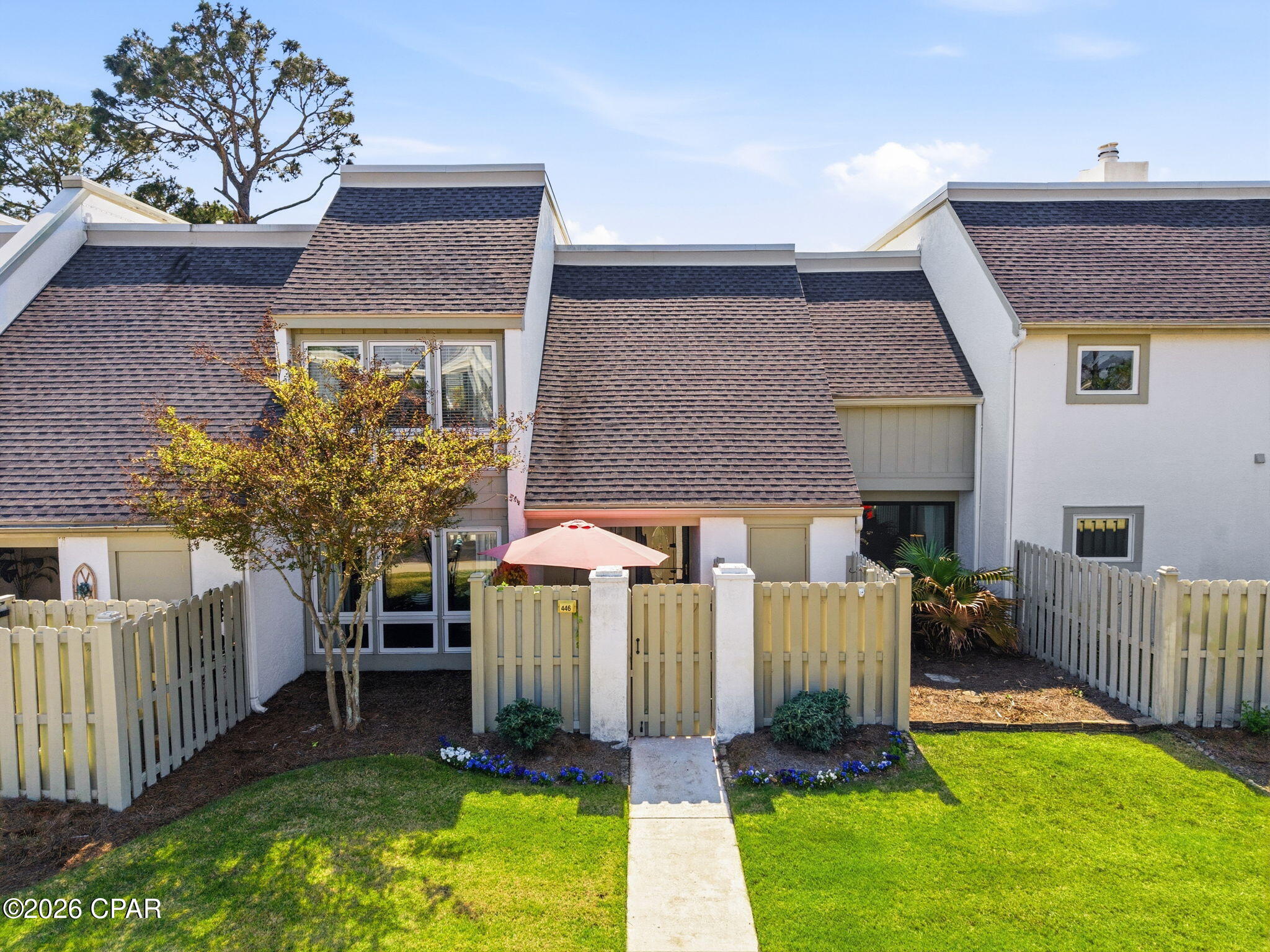 Get ready to fall in love with this stunning move-in ready townhouse in Bay Point Golf Villas II! 🌟 This charming home boasts 2 spacious bedrooms and 2.5 bathrooms, perfectly suited for a life of comfort just minutes away from the beach. 
Step inside to discover a bright and airy living room that flows effortlessly into the updated kitchen and dining area, making it ideal for entertaining. The first floor also features a convenient utility room and a large screened-in sunroom, perfect for enjoying those lovely Florida evenings. Outside, you'll find a generous deck, perfect for relaxing with a good book or hosting friends and family gatherings.
Venture upstairs to find two inviting bedrooms, both with access to a lovely balcony, offering a peaceful retreat. Plus, the upstairs hall features a walk-in closet area for all your storage needs! Safety and comfort are prioritized with hurricane sliding doors in both the dining and living rooms. Recent upgrades include a new A/C unit (2021), a hot water heater, and a fresh coat of interior paint, ensuring you can move in with peace of mind.
The COA fee takes care of building insurance, fire, wind, and flood coverage, along with reserves for exterior windows and doors, painting, roof replacement, and exterior repairs and maintenance. Additionally, the Bay Point HOA fee is $1,650 per year. Don't miss out on this incredible opportunity to live in paradise! 🌴✨
