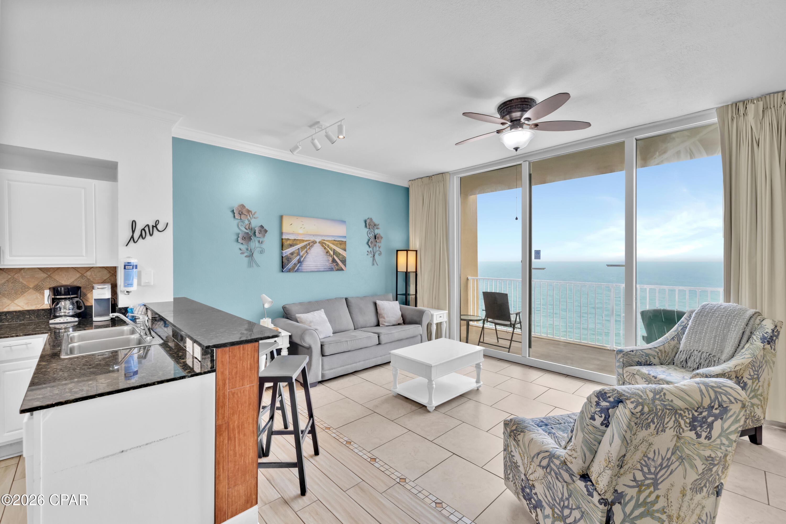 TOP FLOOR LIVING. PANORAMIC GULF VIEWS. TWO TRUE SUITES. THREE FULL BATHS.
Located on the 30th floor of Tidewater Beach Resort, Unit 3013 sits at the top of the tallest condominium building in Panama City Beach, offering a rare top-floor perspective of the Gulf, the coastline, and the beach stretching for miles in both directions. From this elevation, the view becomes the headline, with wide Gulf views, memorable sunsets, and a vantage point few properties can match.
This highly sought-after M floor plan features two private bedroom suites, plus a private bunk room with its own full bathroom. Floor-to-ceiling glass doors frame the Gulf views and bring natural light into the living area, while the beachfront balcony creates a front-row setting above Panama City Beach.
The kitchen features granite countertops and stainless steel appliances. Additional features include an owner's closet, stackable washer and dryer, HVAC replaced in 2020, water heater replaced in 2022, and tile flooring throughout.
With sleeping accommodations for up to 8 guests, this well-maintained residence combines one of Tidewater's most desirable floor plans with the rare opportunity to own a top-floor Gulf-front condo in one of Panama City Beach's most recognizable beachfront towers.
Tidewater Beach Resort remains one of the most recognized vacation destinations in Panama City Beach because of its Gulf-front setting, strong amenity package, and location near major attractions. Owners and guests enjoy two outdoor pools, a heated indoor pool, four hot tubs, a Gulf-front fitness center with Roman spas and saunas, a movie theater, on-site dining, a tiki bar, game room, and beach store. Ownership also includes complimentary professional beach setup with two chairs and an umbrella, adding convenience to time spent on the sand. The 30th-floor owner's lounge showcases panoramic views across Panama City Beach.
Tidewater is positioned near Pier Park, restaurants, shopping, and entertainment, and is also approximately 20 minutes from Northwest Florida Beaches International Airport.
Panama City Beach has also welcomed several newer attractions and entertainment venues, including Dolly Parton's Pirates Voyage Dinner & Show, Topgolf, McGuire's Irish Pub, and Tootsie's Orchid Lounge.
All listing information is deemed reliable but should be independently verified by buyers if important. Any stated sleeping capacity, occupancy use, or rental-related use should be independently verified with current condominium rules, local regulations, fire code requirements, and applicable rental ordinances.