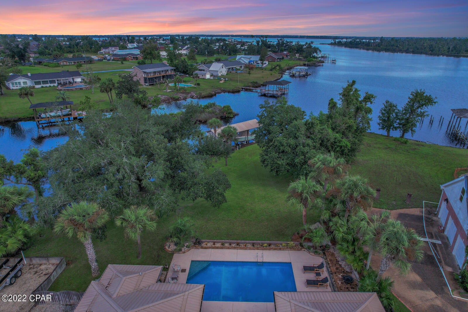 Florida living at it's finest! This beautifully renovated home is seated on more than 3/4 acre of pristine waterfront property in College Point. Over 150ft of waterfront with gulf access, large canal, boat lift, inground pool, NO HOA and a beautifully renovated interior! This home boasts 5 bedrooms, 2 bathrooms, formal and informal dining areas, an open floor plan and gorgeous water views throughout. Step outside the large back door to a covered entertainment area overlooking the pool, gorgeous oak tree and beautiful bay front. Off the canal you will find a large boat lift with boat house and room for additional jet skis, kayaks and other outdoor toys! This property really has it all. Call your realtor today to schedule a private tour! This home is newly renovated. New roof 2016. New AC Unit with purifier installed internally for allergies. New flooring, paint, ceiling fans, sprinkler system in yard, quartz countertops and more. New window treatments throughout home. 10,000 pound boat lift with new cradle and cables 2022.

There is a RING security system installed in the home which includes a sensor on all windows and doors. The exterior RING security cameras do not convey.