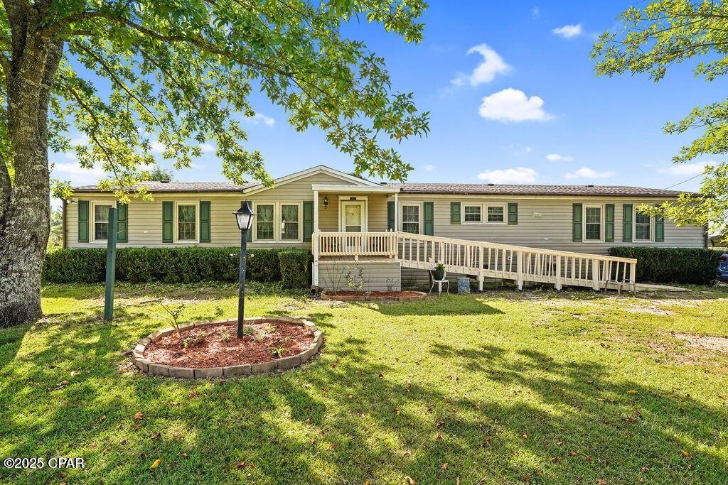 3BD/2BA Country Manufactured Home with solar panels on 2.5 Acres - Updated with Butcher Block Table, Coffee Bar, Garden, Fruit Trees & Sheds!

Enjoy country living in this charming and thoughtfully updated 3-bedroom, 2-bath manufactured home set on 2.5 beautiful acres. This move-in-ready property features fresh paint throughout, brand-new insulation, repaired a newly insulated underbelly, new subflooring, and vinyl plank flooring in most of the home.

The kitchen boasts all-new cabinetry, a stunning butcher block island, and a matching butcher block dining table--perfect for family gatherings. A built-in coffee bar adds the cozy touch, creating an inviting space to start your mornings. Both bathrooms have been updated, and the porches have been refreshed--including a handicap-accessible front porch for added convenience. Each bedroom features a spacious walk-in closet, providing excellent storage throughout the home.

Outside, a limestone driveway leads you home to a setting that blends comfort and practicality. Approximately two acres are chain-link fenced, offering secure space for pets, children, or small farm life. A private, fenced 40 sq. ft. garden is ready for your green thumb, while the property boasts established blackberries, blueberries, strawberries, grapevines, olive trees, mayhaw trees, and several additional fruit trees. The back quarter-acre is separately fenced, making it ideal for small animals, horses, or livestock.

A remodeled well house provides added peace of mind, and two sheds (a small shed and a garden shed) convey with the property, offering plenty of storage and workspace.

This updated country retreat has the perfect blend of charm, functionality, and outdoor living. Don't miss your chance to own a peaceful, move-in-ready home with modern upgrades and room to grow -- schedule your showing today!
