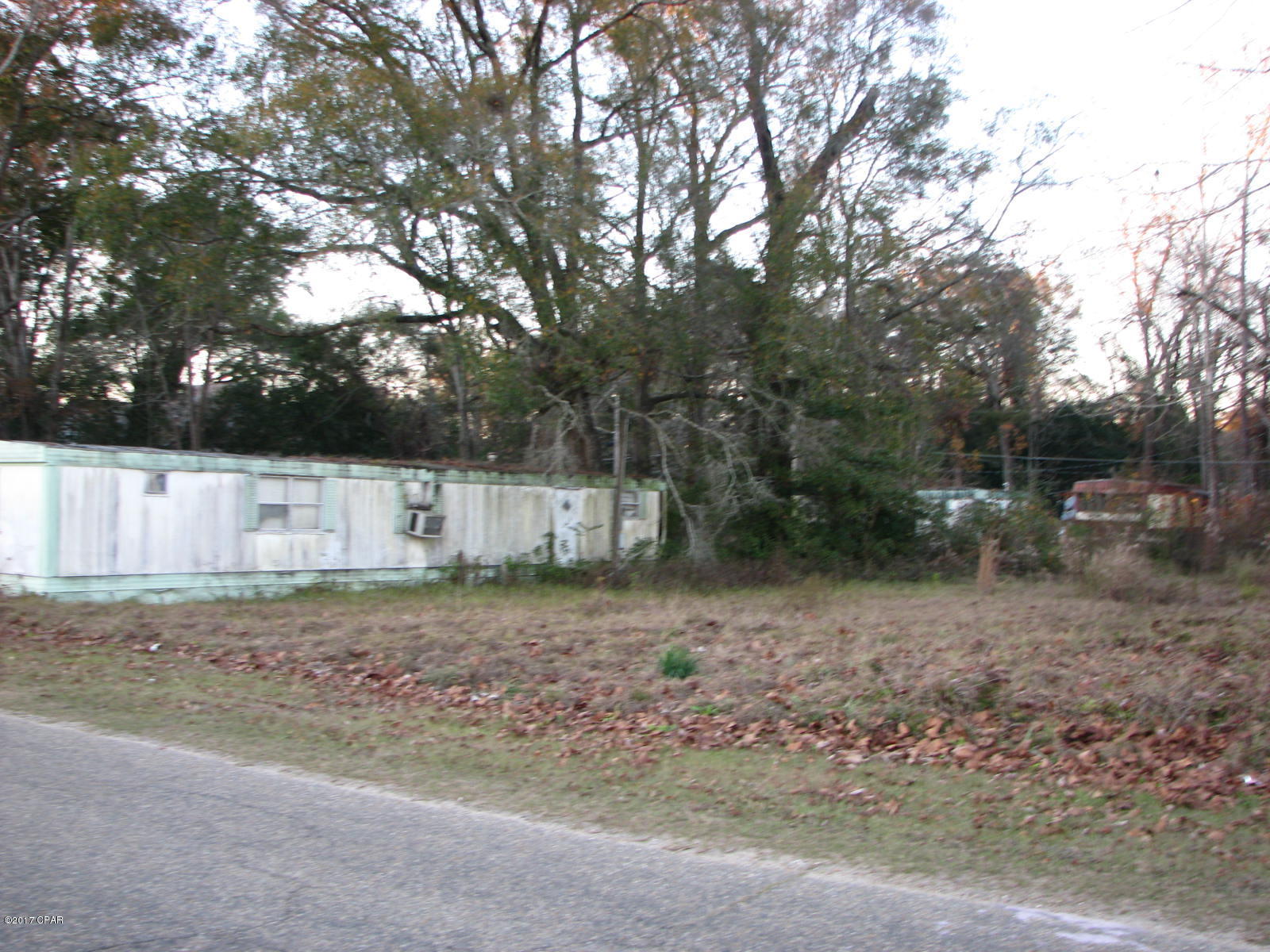 Great investment opportunity. This property has previously been operated as a  5 Mobile Home rental property. The old homes are still on the property and would need to be replaced. The property has city water and sewer ready for new homes to start generating an income.