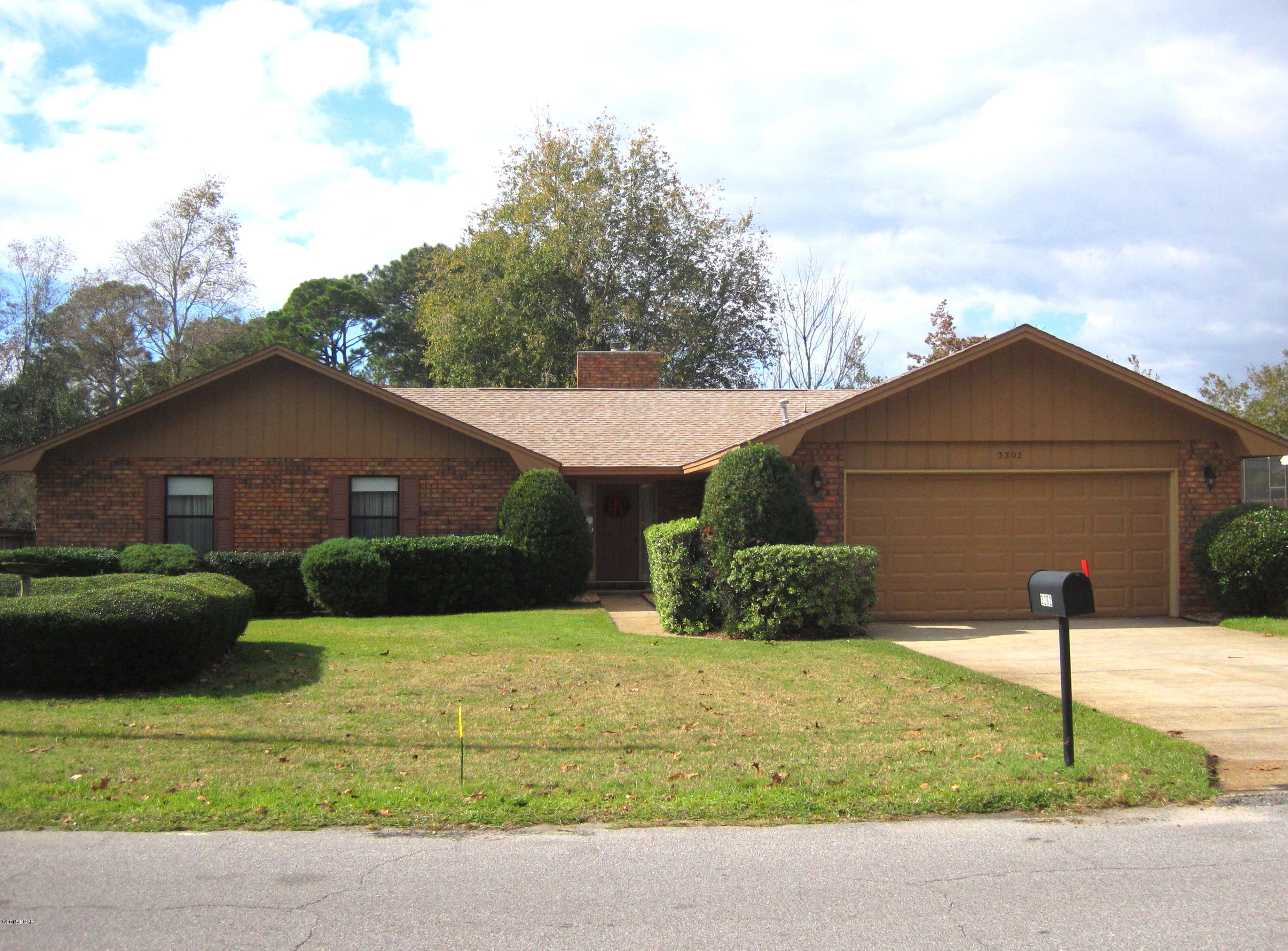Come see this one!!  This roomy, all brick home is conveniently located on a large lot in a great neighborhood near 23rd St. The bright kitchen/breakfast area boasts tile floors and granite counters.  The rest of the home has beautiful hardwood floors.  Other features include a wood burning fireplace, separate dining room, 3 year old roof, large master suite, and very nice screened in deck.  The home and landscape have been very well maintained.