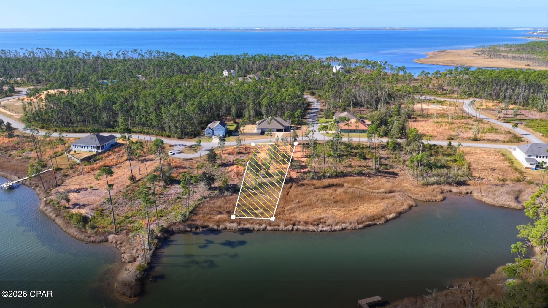 Exceptional waterfront home site with stunning water views located in the desirable gated community of Laird Point. Enjoy peaceful privacy, beautiful natural surroundings, and direct backyard water access to enjoy fishing, kayaking, and paddle boarding. Video Tour Available.

This property gives you the ideal setting for a relaxed coastal lifestyle while remaining a short drive from the dining, shopping, and amenities of Panama City. Waterfront lots in gated communities near the Emerald Coast at this price point--of an interior lots--are increasingly rare.

The lot has been recently cleared, providing a great opportunity to design and build your custom home or hold as a strong long-term investment. Community amenities include Tennis courts and RV & Boat Storage/parking secured area, with public boat ramps nearby for easy water access.

Don't miss this opportunity to own 923 Tidewater Lane has a lot to give, and so close to the Emerald Coast's world-class beaches are just a short drive away, This great water Front Lot is a no brainier. Get it for the price of an internal no water front lot.