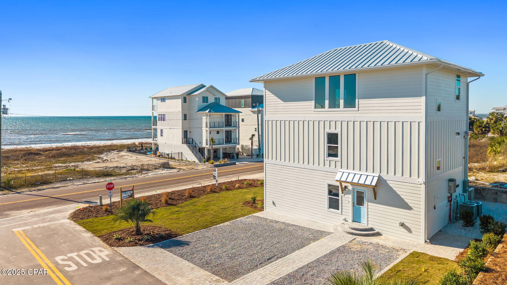 GULF VIEWS AND DIRECT BEACH ACCESS ARE JUST STEPS AWAY! This stunning new-construction home is thoughtfully designed for coastal living and features 4 spacious bedrooms, each with its own ensuite bath, offering exceptional comfort and flexibility for guests, family, or short-term rental potential. Two beautifully appointed primary suites include double vanities and spa-inspired bathrooms. The open-concept living, dining, and kitchen area is perfectly positioned to capture Gulf views, creating a bright and inviting space for everyday living and entertaining.  Step onto the balcony to enjoy coastal breezes and breathtaking sunsets, seamlessly extending the living space outdoors. An elevator provides convenient access to all levels, enhancing comfort and ease of living.  Fully furnished and turn key with an inground sprinkler system and electric vehicle charging station, this is a must see.   Carefully crafted for both function and style, this is 1,152 square feet of modern living space across three levels.  As a first-tier property, it provides easy beach access directly across the street, delivering the coveted beach lifestyle without compromise. Whether enjoying morning coffee on the porch or unwinding to the sound of waves, this home brings the Gulf Coast right to your door. Located along the highly sought-after St. Joe Beach corridor, you're just minutes from the charm of Mexico Beach, with its restaurants, boutiques, boating, and beachside atmosphere. A short drive also takes you to the bay-front parks, fishing, boating, and vibrant downtown of Port St. Joe.  Whether you're searching for a primary residence, coastal retreat, or income-producing rental, this property offers outstanding potential. Call today to schedule your private showing and start Living the Beach Life now!