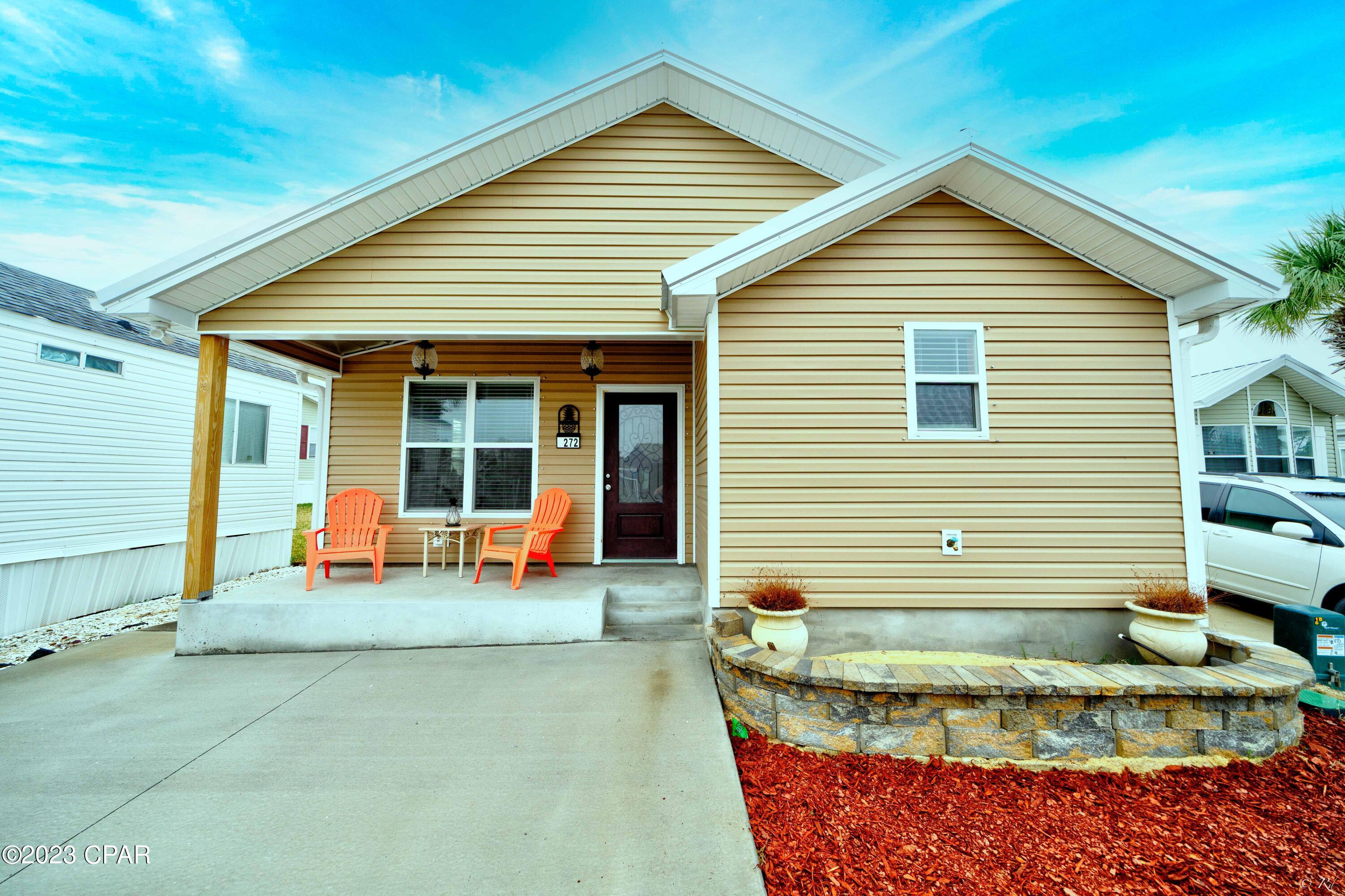CURRENTLY UNDER CONTRACT, SELLER WILL CONSIDER BACKUP OFFERS - Welcome Home! Rare opportunity to own a brand new, 2022 constructed home in Emerald Pointe Resort, one of the highly sought-after communities in Panama City Beach. THIS IS NOT A MOBILE HOME The stunning property has 3 bedrooms, and 2 bathrooms,  Added features include:  galvalume metal roof, 2x6 exterior walls, steel reinforced concrete monolithic foundation, Simpson threaded rod roof to foundation anchoring system, 200 AMP electric service, spray foam insulation, high efficiency HVAC,  hurricane storm window and door protection system, vaulted ceilings, open floor-plan, tankless hot-water heater, LVP flooring throughout, custom shiplap accent wall in dining area and breakfast bar, custom kitchen cabinets, Corian counter tops and window sills, Stainless Steel appliance package, walk-in heated whirlpool tub, vessel sink, custom tile in master shower, sliding barn doors and window treatments throughout home, ceiling fans in the living room and bedrooms, and an attic area that can be finished to add an additional 288 sq. ft. of usable heated and cooled space. There are covered patios on the front and back of the home that offers the perfect place for grilling and relaxing after a long day on the beach. The seller is giving a home warranty for the buyer at closing. This property is the perfect fit for a primary home, vacation home or for an investor. ASK YOUR REALTOR FOR THE COMPLETE LIST OF HOME FEATURES AND OPTIONS AVAILABLE.
Emerald Pointe Resort is a gated community located in the heart of Panama City Beach close to restaurants, shopping, and the world's most beautiful beaches. Amenities include a large clubhouse, exercise room, shared library, 2 pools (one heated seasonally), hot tub, lake with boardwalk, and shuffleboard court. HOA fee includes water, sewer, garbage, cable, and lawn service. All information is approximate and should be verified by buyer if important.