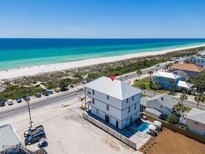 Luxury Gulf-View Property!! West End of Panama City Beach!! VERY HIGH RENTAL PERFORMANCE!! LOCATED DIRECTLY NEXT TO THOMAS DONUTS!!!
Experience coastal living at its finest in this extraordinary 6-bedroom, 5-bathroom beach retreat located on the highly coveted West End of Panama City Beach in the charming Laguna Beach community. Perfectly positioned on an oversized lot with unobstructed Gulf views, less than 100 steps to the beach, this exceptional property offers the ultimate combination of luxury, investment potential, and lifestyle.

Designed for entertaining and relaxation, the home features a private resort-style pool, two spacious upper-level balconies showcasing breathtaking sunsets over the Gulf, and premium indoor and outdoor living spaces throughout.

Inside, you'll find an impressive collection of ultra-premium appliances, designer furnishings, and curated coastal décor, creating a truly turnkey luxury experience. Every detail has been thoughtfully selected to provide both elegance and comfort.

A rare and highly desirable feature is the 1,800-square-foot heated and cooled two-car garage,complete with its own bathroom--ideal for storing boats, recreational vehicles, golf carts, creating a workshop, or additional entertainment space.

With NO HOA, there are no restrictive association fees, allowing for maximum flexibility and excellent investment opportunities. The property boasts outstanding rental performance, making it an ideal primary residence, second home, or income-producing vacation rental. Located just steps from the sugar-white sands of the Gulf and next door to the world-famous Thomas Donut & Snack Shop, this property places you in one of Panama City Beach's most sought-after destinations, close to Pier Park, dining, shopping, and endless coastal activities.

This is more than a beach home--it's a truly rare opportunity to own a premier Gulf-view estate in one of the most desirable locations on the Emerald Coast.