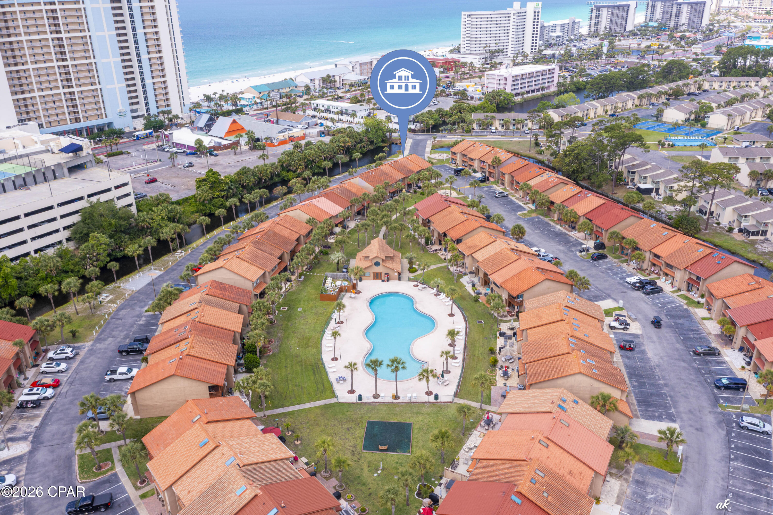 Welcome to the highly sought-after island section of Gulf Highlands Beach Resort! This unit at 223 Grand Island Blvd is ideally positioned as one of the closest properties to the pedestrian beach access, making your trips to the sugar-white sands quick and convenient.

The beach access is located just across Front Beach Road, and while it is a main roadway, the proximity from this unit makes getting there incredibly easy. Owners also have the added perk of being able to take and park a golf cart even closer to the access point, making beach days that much more effortless.

Located within the resort's unique island enclave, this section stands out with its coastal-style siding and signature clay tile roofs, offering a charming and distinct feel. Inside, the unit features LVP flooring throughout, a convenient half bath on the main level (perfect after beach or pool days), and sliding glass doors that open to your private patio just a short walk from one of the community pools and clubhouse.

Upstairs, you'll find two spacious bedrooms, each with its own en-suite bathroom, ideal for guests or maximizing rental potential. While the interior offers an opportunity for updates, the location and layout make this an incredible value.

Centrally located in the heart of Panama City Beach, you're just moments from Pier Park, Shipwreck Island Waterpark, and M.B. Miller County Pier, with endless options for dining, shopping, and entertainment along the Front Beach corridor. Whether it's a quick beach day, grabbing dinner, or enjoying local attractions, everything you need is right at your fingertips.

Gulf Highlands Beach Resort offers a gated, amenity-rich lifestyle with multiple pools, tennis courts, and one of the most convenient beach access points in the area.

Whether you're searching for a second home, investment property, or your own slice of PCB, this one checks all the boxes when it comes to location and potential.