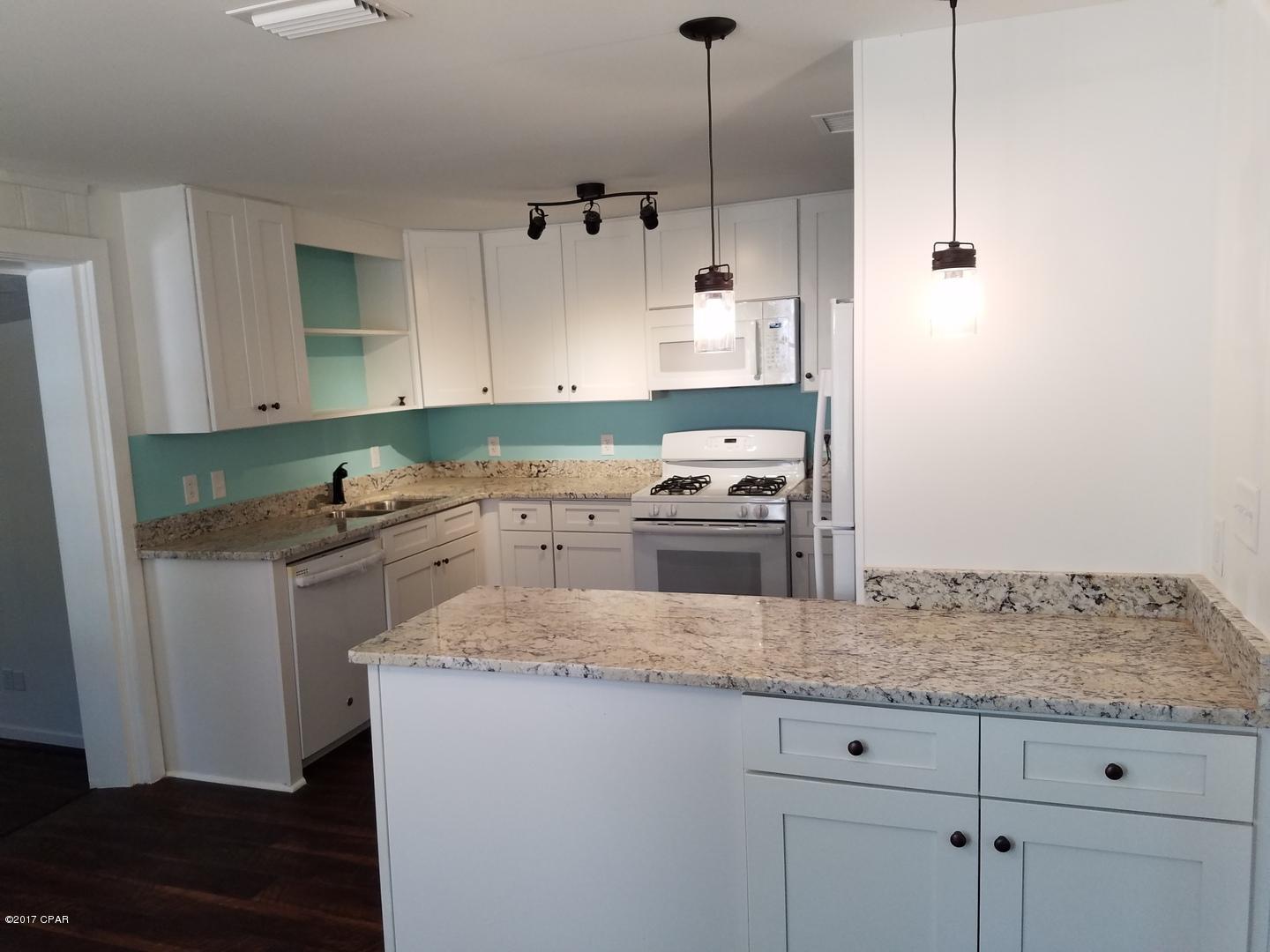 This 5 bedroom, 3 bath home is centrally located in Panama City just two blocks from the local boat ramp with Bay access! As you walk through the front entrance, you come to the first living area, three bedrooms, and a full bathroom. These rooms feature original hardwood flooring which has just been refurbished. The luxury kitchen has granite counter tops and brand new appliances including a gas stove/oven. The laundry room with washer/dryer hookup is located just off the kitchen. The first master suite is also located off the kitchen and features a walk-in closet and an adjoining private bathroom. From the kitchen, there is another living room that is extremely spacious and offers access to the side deck. The second master suite is very large and features an adjoining private bathroom. Dog under 20lbs negotiable with $300 non-refundable pet fee. No cats.