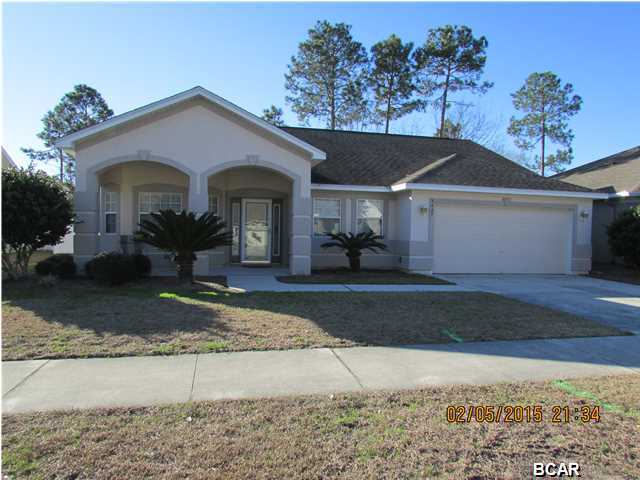 Beautiful 3 bedroom 2 bath home in the desirable Hammocks subdivision. This home features very open floor plan, gas fireplace with space for a large television, cathedral ceilings, 18 in. tile flooring in the kitchen, foyer and living room, as an extra bonus there is niche in the living room making for endless decorating options, arched pass through at breakfast bar, new refrigerator, ceiling fans throughout, an amazing amount of room for gatherings of family and friends, the breakfast area has a nice bay window allowing for natural lighting while you enjoy your morning cup of coffee. Dining area has new carpet as well as the additional two bedrooms. Spacious master suite with two closets, garden tub/shower, double vanities with a private exit to the patio retreat. The large