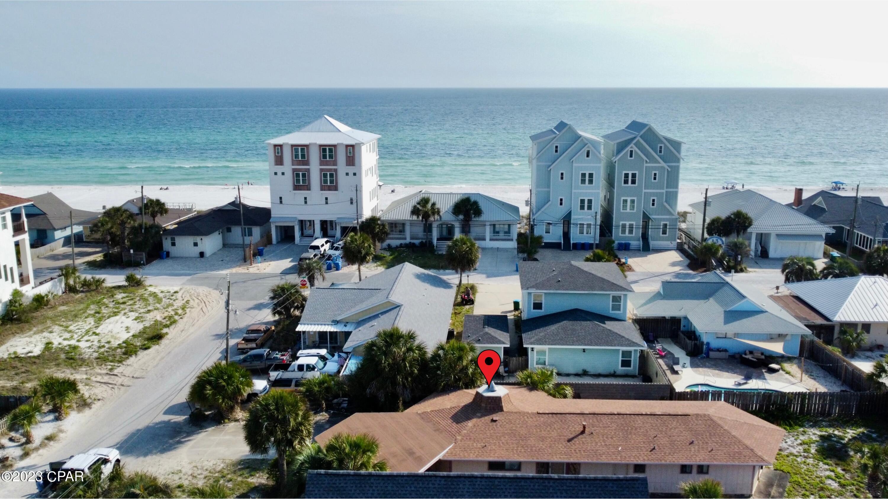 *CURRENTLY UNDER CONTRACT, SELLER WILL CONSIDER BACKUP OFFERS* BUILD YOUR OWN DREAM 8 BEDROOM 8 BATH VACATION HOME WITH THE PLANS THAT CAN COME WITH THE SALE OF THIS HOME WITH A FULL PRICE OFFER!! Opportunities like this only come around once in a lifetime with this very special lot that allows a build of up to 100ft high and not in a flood zone.  Short Term rentals allowed, South of Thomas, and 30 steps away to Beach Access 13.  The best part here is there is an existing home on this lot so you can finance the entire purchase with a bank. This home can be renovated, but the best and highest use for this property is in building a massive home on the property. Plans to build an 8000 sq ft, 5 story home complete with movie theater, gym, game room, elevator is included.  Huge opportunity to build a multi-million dollar home.  Make it your primary residence, vacation home, or rent it as a short term rental!  It's all allowed.  Drone pictures attached show potential view at 65 ft high, however can be built up to 100 ft high according to bay county zoning.  Large yard allows for multiple backdoor entertainment options. Whether you decide to knock it down and take advantage of the opportunity to build a large short term rental that is projected to gross $360,000 a year or live in it or rent it out you can't go wrong. With its very close beach access, to the beach and some of the best restaurants, you will be happy you chose this spot of paradise. Look around all of Panama City and you won't find any home with the amenities this house has making it a truly unique opportunity.  Don't miss out on this once in a lifetime chance to own this unique piece of Panama City Beach property.