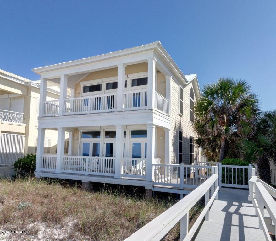Carillon Beach is a wonderful gated community located at the far West end of Panama City Beach. Amenities include a Beach Club, 3 pools, tennis courts, shops and dining and a mile of pristine beach. This well designed Beach home offers endless Gulf views from the main living area and Master Suite. Relax on the expansive balconies, slip away onto the sugar white sand via the private walkover or take a swim in the nearby community pool. Inside is a host of dramatic architectural features, including walls of windows and glass doors bringing in the breathtaking Gulf views. The living room is a perfect blend of casual elegance and style with, tall glass windows and doors for natural lighting and access to a large covered, balcony. The large open, eat-in kitchen features a wall of cabinetry  and long breakfast bar with granite countertops, The main level also features a powder room and guest bedroom with private bath. The double doors in this guest bedroom open to a large covered balcony. A stairway off the foyer leads downstairs to a guest room with hall bath, a full size laundry room and a one car garage with extra storage area. The third level features soaring tongue and groove wood ceilings. The impressive master suite with private bath offers the sound of the gentle waves from a large covered private balcony. Additionally, there are two generous guest bedrooms with a shared full bath on this level. (An elevator could easily be added). This fully furnished home is a family beach retreat for the ages. It is ''Rental Ready'' and convenient to all the wonderful amenities of Pier Park as well as the dining, entertainment along Hwy 30A.