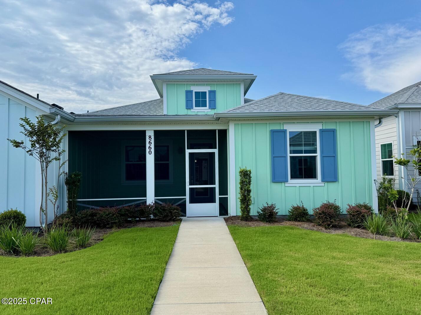 MOTIVATED SELLERS!! RENTAL AVAILABLE!! NEW TILED FLOORING  THROUGHOUT INSTALLED JUNE 2025!!! This Camellia cottage is move-in ready! Come join the fun at Minto's 55 and Better Community located just minutes away from our beautiful Emerald Coast beaches! Stepping into the bright, Living Room/DR/Kitchen open plan has navy vaulted beams (upgrade) that gives you a coastal vibe along with navy cabinets (upgrade) This open concept makes this a spacious home. 8' doors (upgrade) throughout, utility sink in garage (upgrade), deep window sills, glass front door (upgrade), upgraded garage door opener, gutters, guest bath tiled walls to ceiling (upgrade), pocket door at master bath, high TV jacks, garage insulation (upgrade), super charger in garage for your golf cart (upgrade), extra can lights, 3 ceiling fans inside and one on screened lanai, kitchen sink tilt out (upgrade), Carrera Bianco quartz on all counters (upgrade), garbage disposal switch on counter (upgrade), level 3 backsplash (upgrade), SS refrigerator and range. 
Admiral navy cabinets throughout, Gibson nickel plumbing, laundry room cabinets, Whirlpool washer and dryer, custom interior paint and beams (upgrade), blinds (upgrade), etc. Approx. $68,000 in upgrades! Plenty of light comes in through these windows, for sure! This home is located steps away from a large pond with gorgeous sunsets and a tiki area for gathering in the afternoons! Bring your chairs and enjoy the sunset with your neighbors! This is a great opportunity to live in this wonderful community! You will enjoy the completed community amenities with resort-style pool with live music throughout the week under the pool tiki hut! The restaurant and the upstairs Overlook Bar restaurant overlooks the intracoastal waterway for casual dining and great food! Prices are fantastic! The Fitness Center offers state-of-the-art workout equipment along with daily exercise classes in the separate yoga room with a ballet bar/mirrors and spin room. There is an indoor, 3 lane pool with a Jacuzzi! There are 9 pickleball courts as well as tennis, 5 bocce ball courts along with a grassy area with cornhole, pool table, ping-pong table and a putting green! The Band Shell offers live or DJ  music every Friday and Saturday night! There's a kayak launch, too! There are many weekly events offered to all homeowners. There is a St. Joe Marina being planned for this community. The Barkaritaville dog park is available for our best friends and a dog wash area in our newly added building along with a Hangar workshop, pottery studio and a 200 seat Last Mango Theatre with different activities weekly! Publix is being built on site! Restaurants, shopping and multi-use businesses will be completed in the near future.  Currently there is a bank, golf cart store.  Call Listing Agent for a private tour of this incredible community!