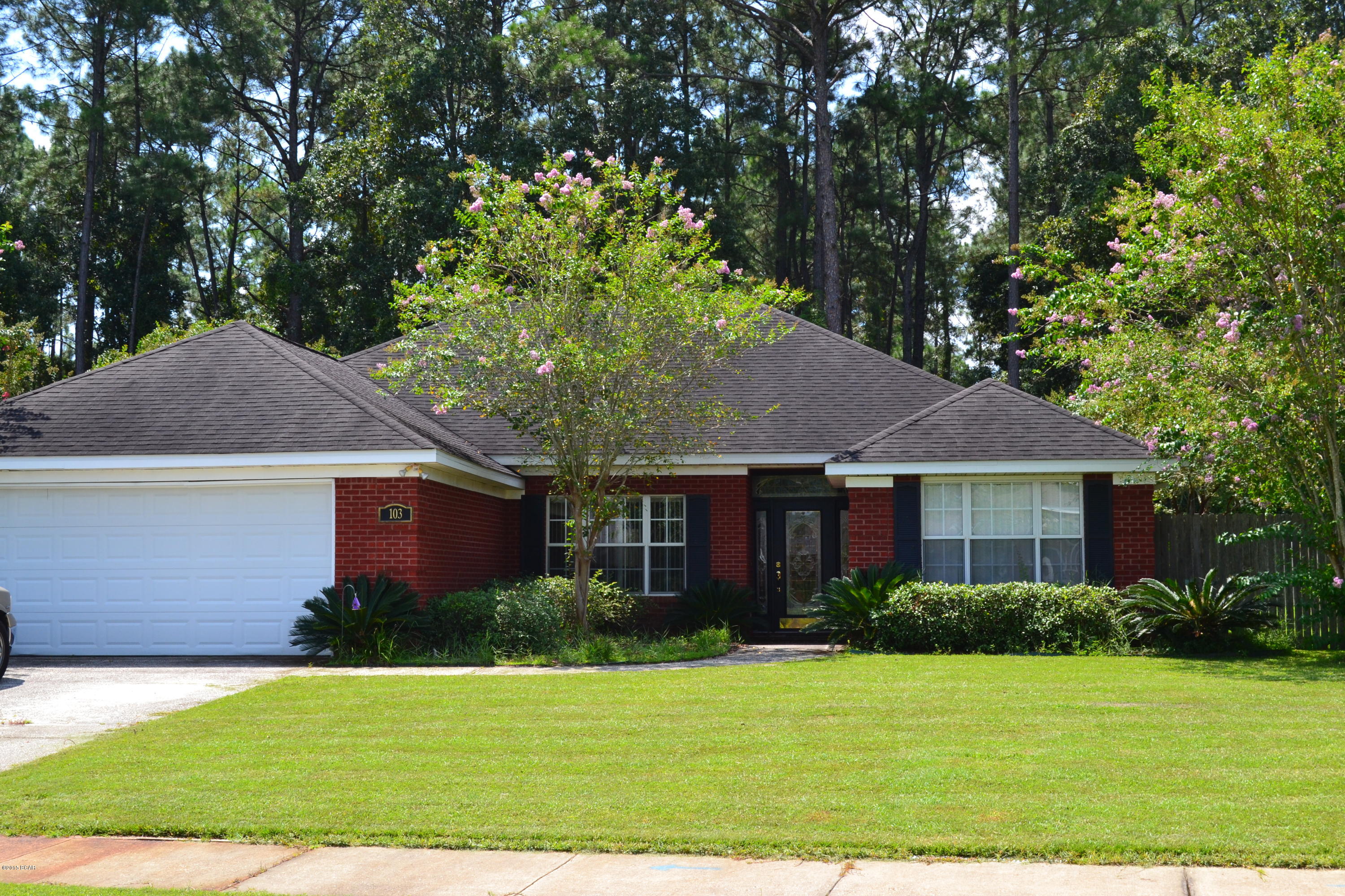 Solid all brick, contemporary construction in one of Lynn Haven's most desirable neighborhoods, The Landings. This 3 bedroom 2 bath home was built with quality and livability in mind. The interior is very open with hardwood floors in the living room and dining room and tile in the kitchen and baths. A fireplace is the focal point of the living room. The kitchen has an abundant amount of solid maple cabinets topped with stylish counter tops and complimented with a generous appliance package.  The master suite is HUGE and features a master bath with double vanities, separate tub/shower and a walk in closet.  Both bedrooms 2 and 3 are spacious and share a full bath. This home has a great layout and will fit the largest of furniture.  Call today for a private viewing
