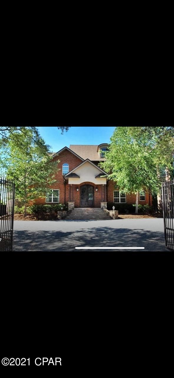 This beautiful, waterfront home is quality through and through and sits on almost 300 feet of open water on North Bay.  Dramatic foyer with winding staircase introduces this open and spacious 7,000+ SF main home with 6 bedrooms, 4 full baths, 2 half baths and a quarter bath in garage. Gorgeous formal living area features a fireplace and floor to ceiling windows for open views of the Bay. Beautiful white oak flooring in main living areas and heated stone flooring in kitchen, office and master bath. Granite counter tops, breakfast bar (and breakfast nook with views of the Bay!) custom cabinets, high end appliances with 2 dishwashers, 2 convection ovens, warming drawer and center island. Large walk in closet with beautiful custom storage cabinets and convenient washer/dryer. Home office just off kitchen has custom cabinetry built in file drawers and granite top work areas. Large rec room upstairs with mini kitchen area including dishwasher, and deck area overlooking the Bay. Exercise room, second story, full laundry area, 2 separate 80 gallon, instant water heaters, 3 high efficiency heating and a/c systems with zoning, 2X6 exterior wall construction, independent irrigation meter, security system, fully sealed basement area, detached 1,290 SF, 4 car garage with heated/cooled storage area, wet bar, ice machine and convenient half bath. Call to your realtor for a private showing.