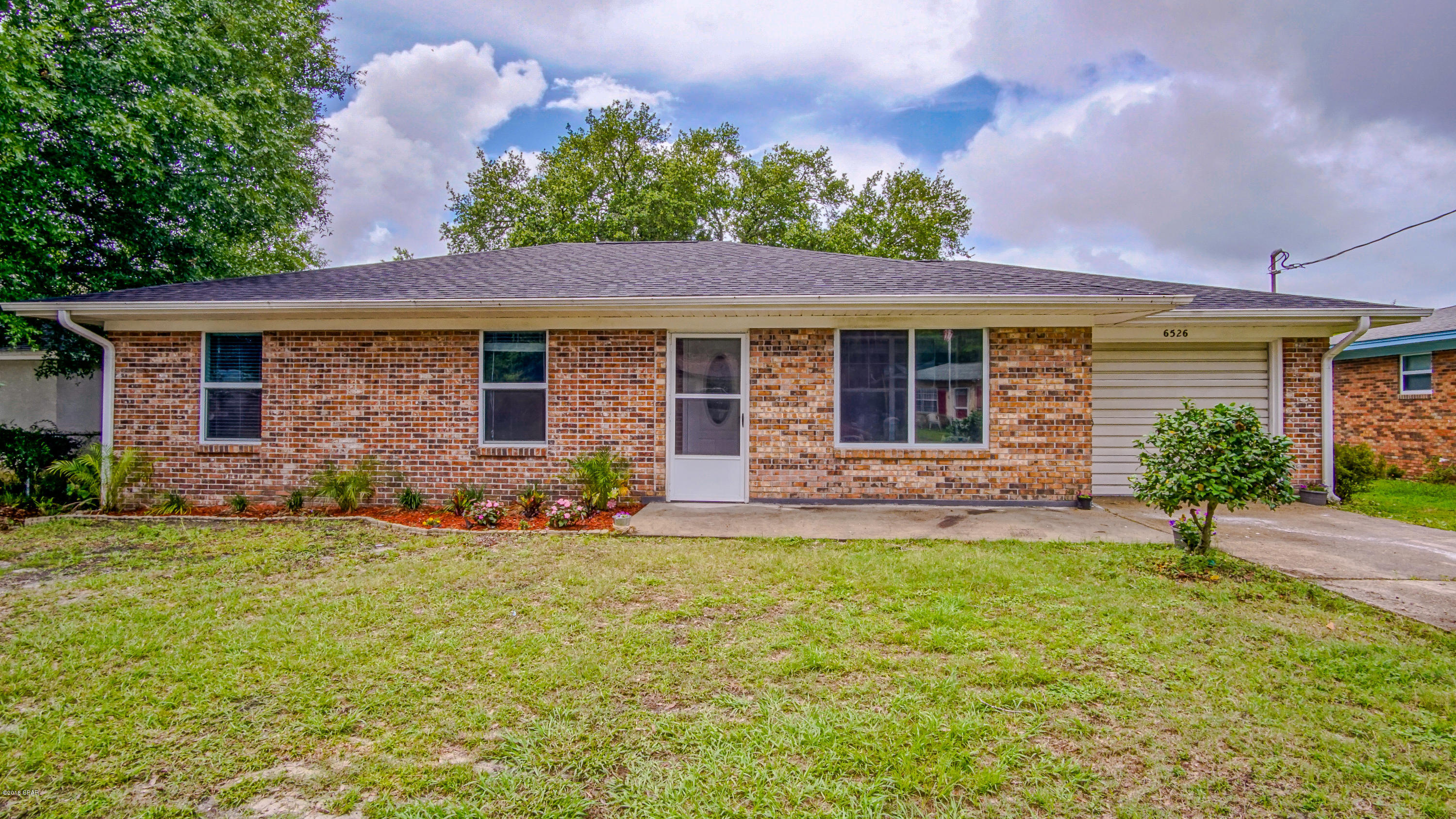 All brick 3 bedroom 2 bath home close to Tyndall AFB! This gorgeous home has been remodeled within the last 2 years with a new roof (2016), oak laminate flooring throughout, new doors, fixtures, and hardware. The living room is large with slider doors to your backyard. Kitchen offers granite countertops, 3x12 glass subway tiled backsplash, whirlpool stainless steel appliances, huge pantry, and breakfast bar. Master bedroom has a walk in closet and master bathroom with 24x12 porcelain tile flooring and porcelain tiled shower.
