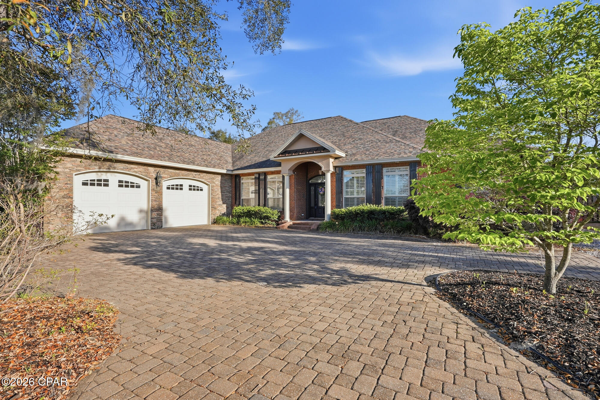 Located in a quiet neighborhood with no HOA, this property offers a combination of privacy, functionality, and long-term flexibility. Featuring tall ceilings and 8-foot doorways throughout, complemented by all bedrooms being large and a spacious walk-in closet in the master bedroom. This gated neighborhood amenities include a private dock and boat launch located approximately half a mile away on Deerpoint Lake. A standout feature is approximately 1,000 square feet of unfinished upstairs space, offering the opportunity to create additional living area, bonus space, office, recreation room, or use for storage. The home also features a whole-home generator capable of powering the property for up to 30 days depending on usage and load management, along with a large propane tank on site for added utility support. The backyard is fully fenced for added privacy and security, and features additional exterior structures to include a pole barn and separate shed, offering ample storage and workspace options . The oversized garage includes rear access through a third garage door providing convenient access for lawn equipment and yard tools. Outdoor living is enhanced with a screened-in back porch with an oversized swing ready for entertaining or just relaxing. Safety features include hurricane shutters installed around the entire home, including an remote controlled electric roll down protecting the front door, as well as a security camera system.  All information is deemed reliable but not guaranteed. Buyer to verify if important.