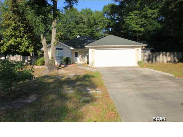 This nice 3 bedroom 2 bathroom home sits on a huge corner lot in Lynn Haven with several dining and shopping options nearby. Once inside you will see all of the beauty this perfect family home has to offer. The grand living room is very spacious and features an eloquent gas fireplace, ideal for the winter months. Both the dining room and kitchen are beautifully tiled and the kitchen boasts plenty of all white cabinetry as well as an oven/stove combination, microwave, and dishwasher. Inside the spacious Master bedroom there is elegant center accent lighting as well as a view of the large backyard. Master bathroom has separate vanity area with the walk-in closet and also in the bathroom is a shower/tub combo. The two additional bedrooms are both decent sized. Front bedroom is tiled MakeOFFER