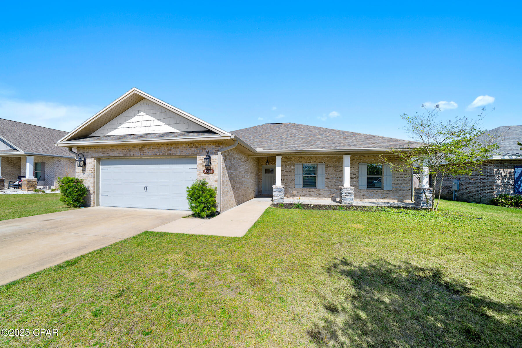 Gorgeous 4 bedroom/ 2 bathroom BRICK, split  floor-plan home conveniently located just off Hwy 231 minutes to Tyndall AFB, Dining, Shopping & More!  This Gary Morgan build showcases a spacious covered front porch with beautiful landscaping, fenced backyard, and covered back porch. Interior showcases luxury vinyl plank flooring and crown molding throughout all common areas and master suite. Foyer leads to an open-concept living room featuring a tray ceiling with recessed lighting, and electric fireplace with stone accents. Living room flows seamlessly into the kitchen featuring a breakfast bar, eat-in dining area, granite countertops, shaker style cabinetry, stainless steel appliances including a double oven, pantry, and laundry room access. Master bedroom and en-suite sit just off the kitchen featuring a tray ceiling, granite countertops, double vanity's, soaker tub, separate tiled shower, and walk- in closet. Secondary bedrooms feature carpet flooring, and share a full guest bathroom; featuring double vanity's and shower/tub combo. Call to schedule your private showing today!