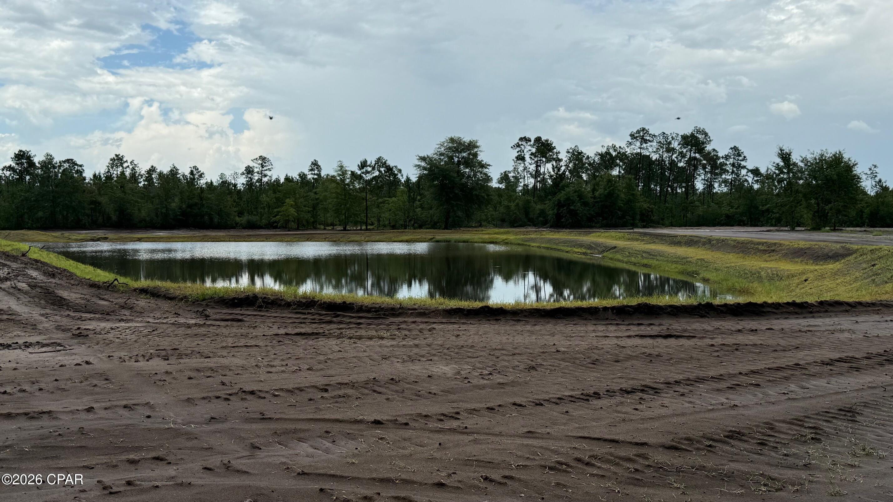 Medlin-Clark Ranch, LLC presents a rare land investment opportunity in Fountain, Florida, delivering a clean slate for strategic development. This tract offers investors a Timber/Recreational/ Hunting setting. The property is currently being high fenced for deer. There's a small lake been dug on the property for private fishing. 
The property appeals to those seeking a private yet connected parcel with strong potential for future appreciation. Thoughtfully positioned for efficient site work, this offering supports a variety of land use possibilities tailored to long-term portfolio growth. Investors can capitalize on the location's undeveloped nature to design a project that meets specific objectives while leveraging the surrounding region's steady demand for thoughtfully planned land.