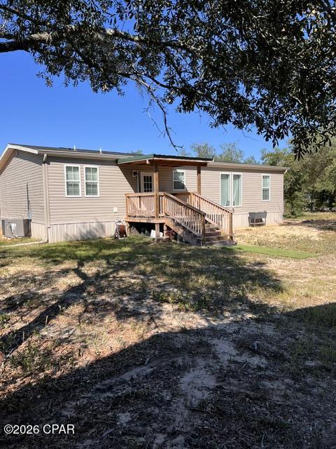 Quiet, secluded 3 bedroom 2 bath country style home on 4.5 beautiful acres.   16x18 Covered back porch with composite decking to minimize maintenance.  Large 3 bay pole barn, 2 deep wells.  Open floor plan with large granite island in the kitchen, large dining area, separate laundry room and split bedroom plan. Master bathroom has double vanity, rain shower head in the shower and large free standing soaking tub.  Second bathroom has double vanity and tub/shower combination.  All appliances are included and most furniture and accessories will convey.  Fenced and gated, pie shaped lot, survey is available. INCLUDED in purchase is a 2022 Mahindra 1626 HST 4WD tractor with under 50 hrs , and 5 ft. box blade, bucket, and cutter. Horses allowed.
