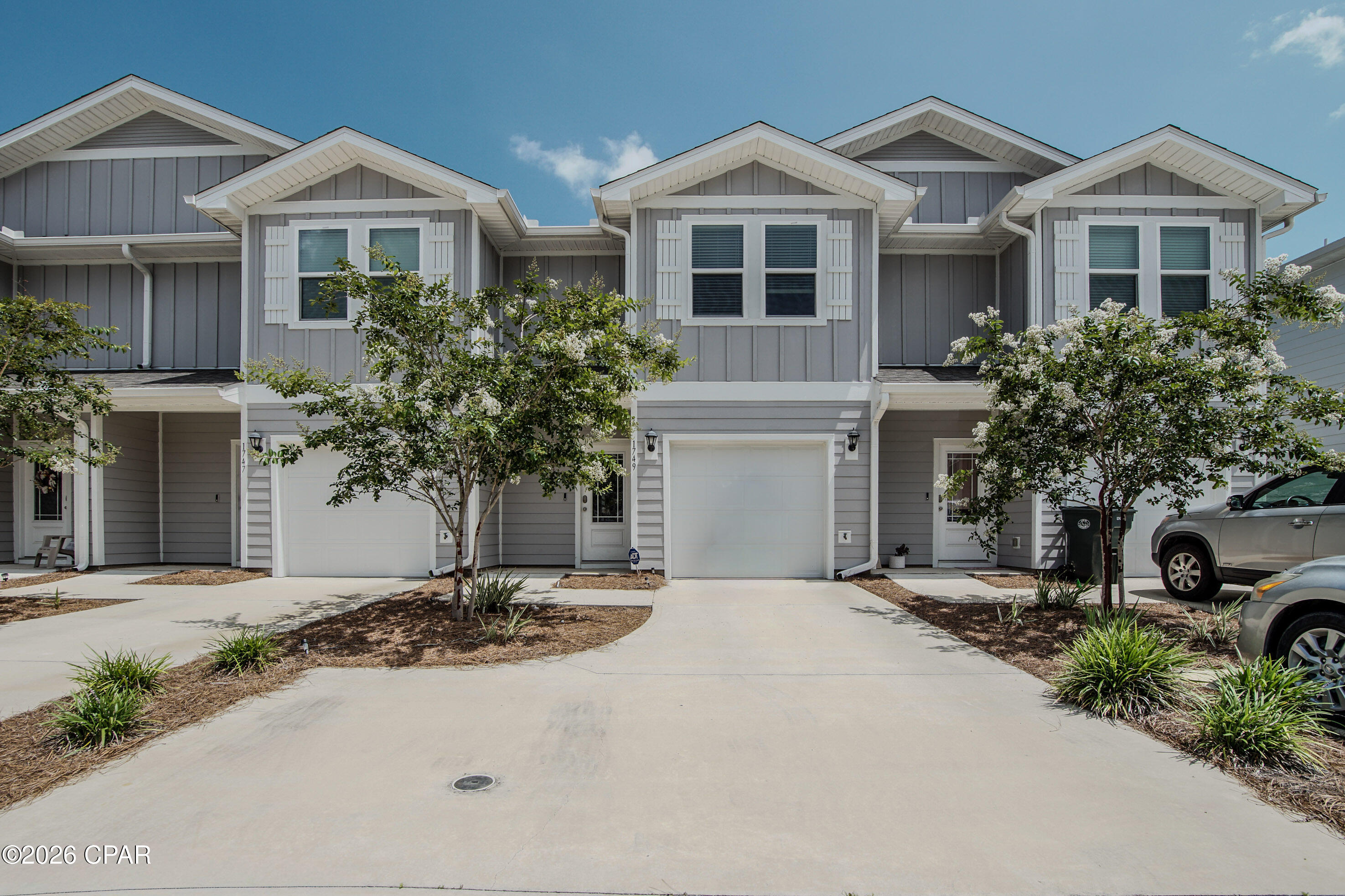 Welcome to modern, low-maintenance living at Jakes Landing! Built in 2023, this immaculate 3-bedroom, 2.5-bathroom Craftsman-style townhome perfectly pairs everyday comfort with unbeatable convenience. The bright, open-concept main floor features a kitchen that overlooks the spacious living and dining areas--ideal for hosting friends or relaxing after a long day.
Upstairs, you will find all three bedrooms alongside a dedicated laundry room. The generous primary suite acts as your private retreat, boasting a large closet and an en-suite bathroom complete with a dual-sink vanity. 
Step outside to your private back patio to enjoy your morning coffee, and take advantage of the attached 1-car garage for extra storage or parking. 
Located just a short drive from top-rated local schools, shopping, and dining, this turnkey home is ready for its next chapter!
