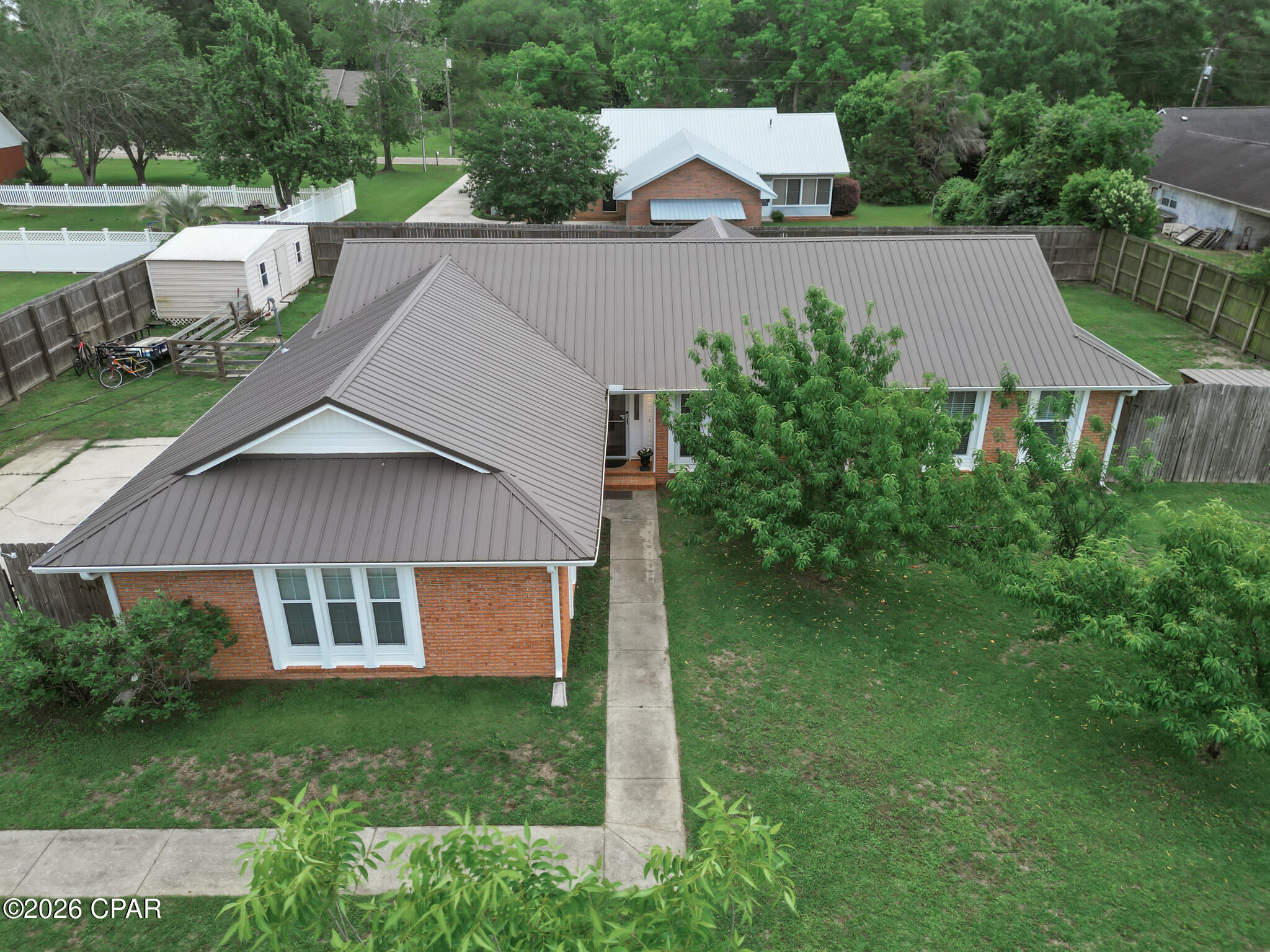 !!! MOTIVATED SELLER!!! Space, Comfort & Endless Storage in Graceville!

If you've been searching for a home that blends comfort, convenience, and functionality--this is it. Nestled in Graceville, this beautifully maintained property offers the perfect balance of small-town living with easy access to Dothan's dining and shopping, plus the beaches are just a short drive away for weekend getaways.

Step inside to discover an inviting open-concept layout where high ceilings and natural light create a spacious, airy feel. The living and dining areas flow seamlessly together--ideal for entertaining or relaxing with family. The kitchen features updated moody gray cabinetry, modern countertops, and a garbage disposal, giving it a fresh, contemporary look.

The primary suite is a peaceful retreat with new flooring, updated paint, and a therapeutic step-in whirlpool tub for ultimate relaxation. Bedrooms 2 and 3 are generously sized and privately located on the opposite side of the home--perfect for guests or family.

This home is packed with thoughtful upgrades: a high-efficiency tankless water heater, one-year-old seamless gutters, a 23 SEER heat pump with a transferable 10-year warranty, new ductwork, and a UV sterilizer--great for pet owners and allergy relief.

Outdoors, enjoy your own private haven. The screened-in back porch with an aluminum ramp offers easy access and a comfortable space to unwind. The fenced backyard provides plenty of room for pets, gardening, or play. In the front yard, established fruit trees and berry bushes add charm and a touch of country living. A 12'x24' metal storage building with lighting and attic storage above the converted garage means you'll never run out of space.

The heated and cooled converted garage adds even more flexibility--ideal for a home office, craft studio, or game room.


All measurements are approximate and not guaranteed.